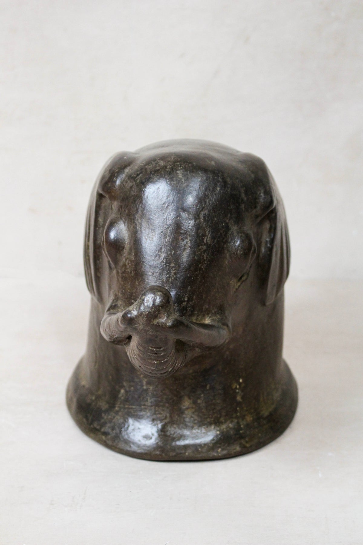 Mangbetu terracotta elephant head sculpture — front view