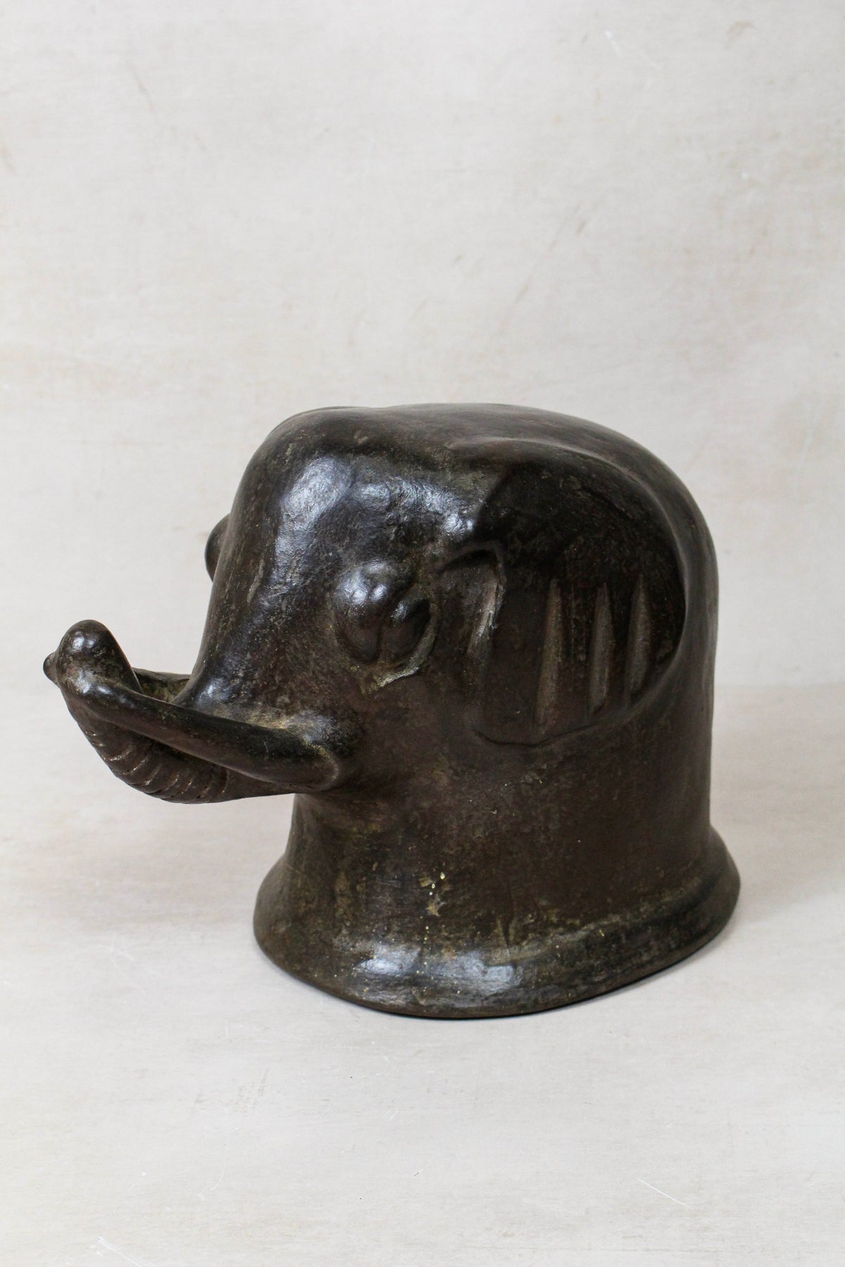 Mangbetu terracotta elephant head sculpture — side view