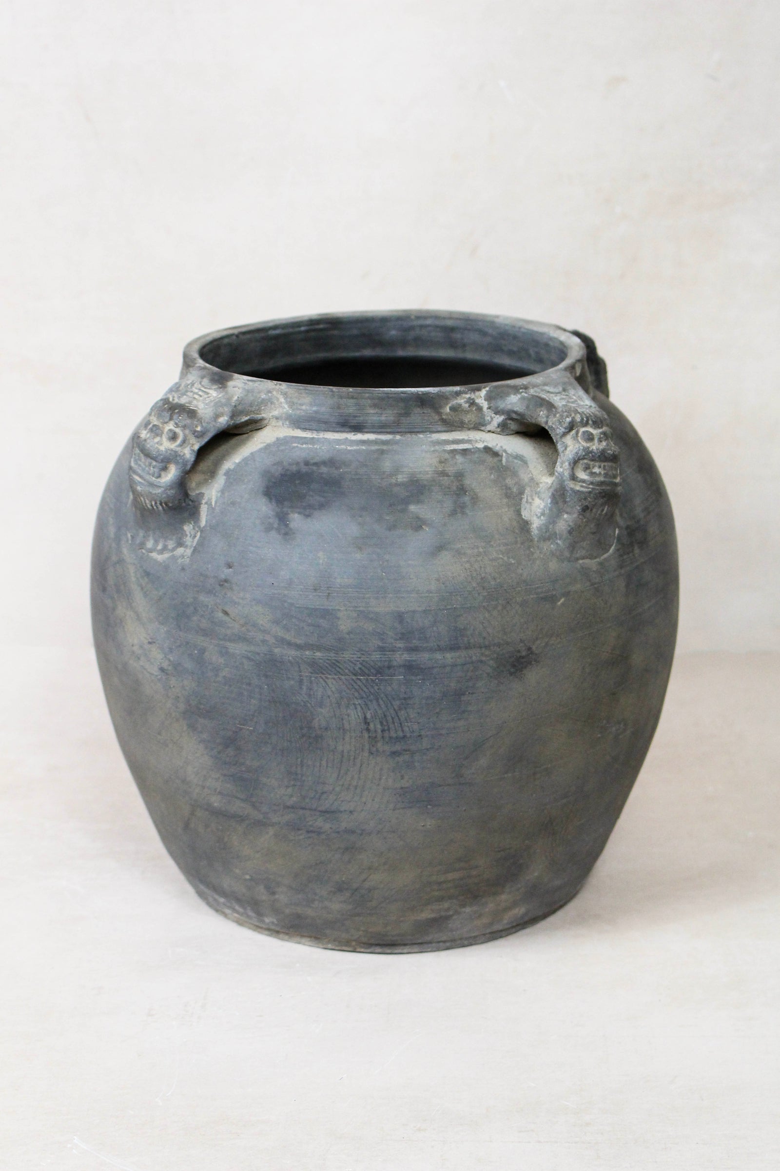 Vintage dark unglazed earthenware pot with lion-ear handles from Shanxi, China