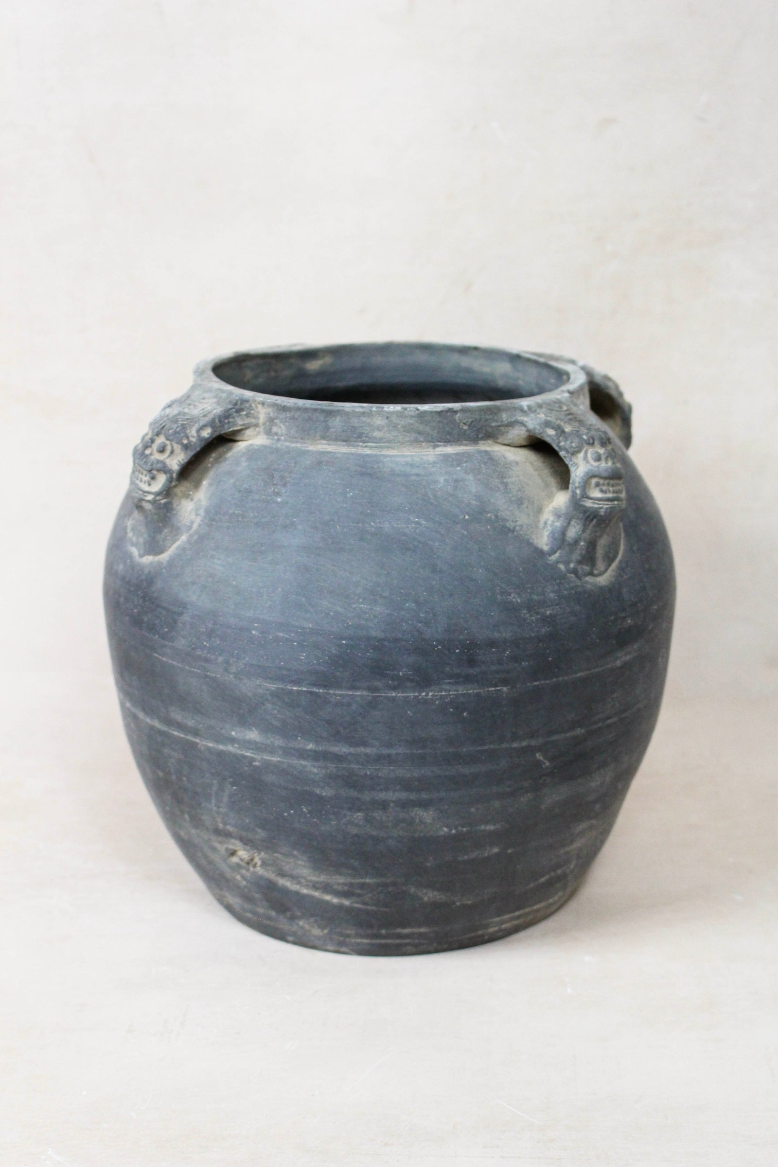 Vintage dark unglazed earthenware pot with lion-ear handles from Shanxi, China