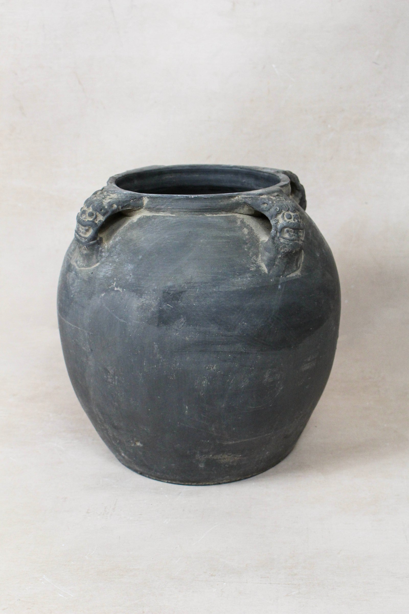 Vintage dark unglazed earthenware pot with lion-ear handles from Shanxi, China