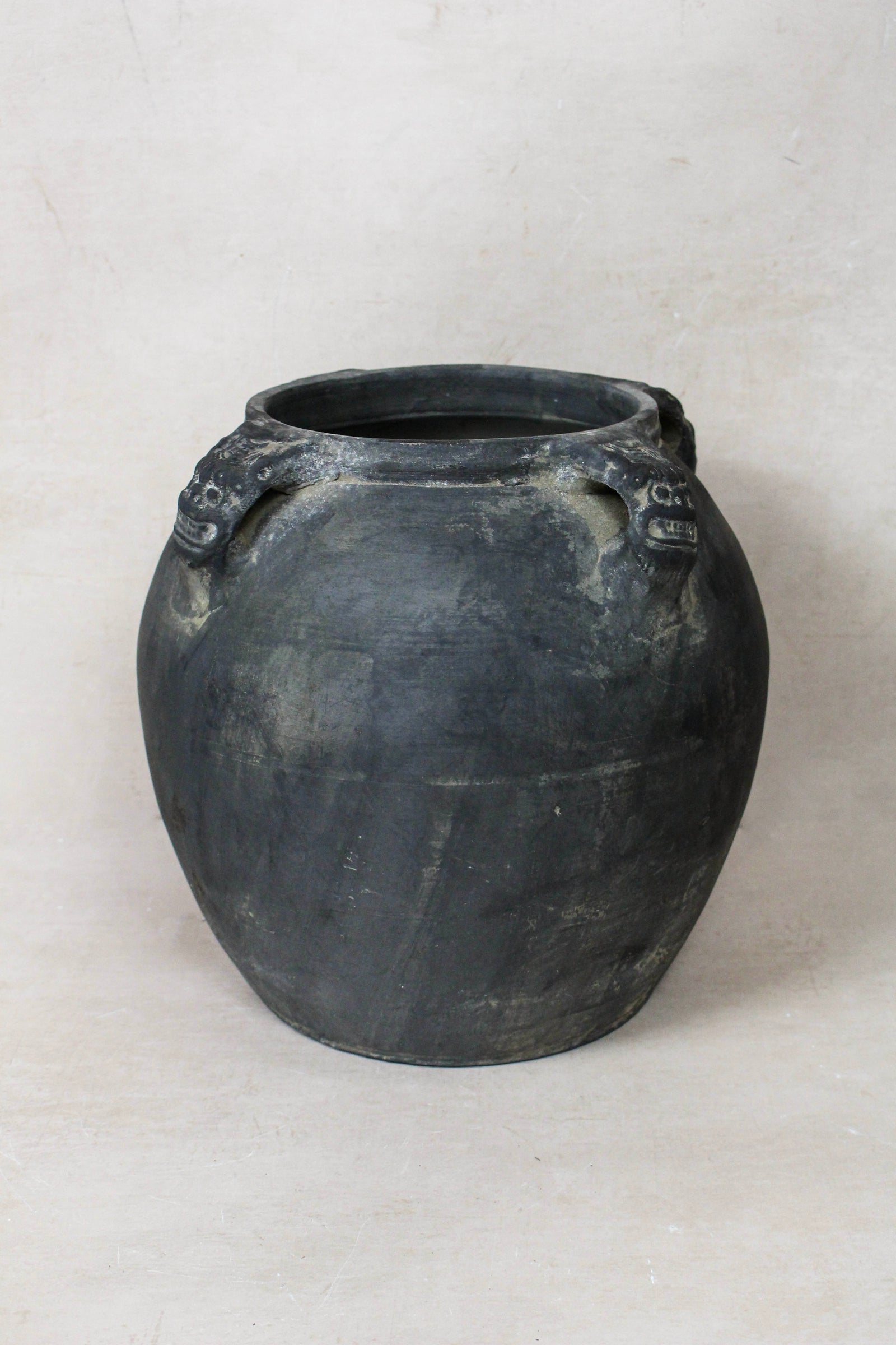 Vintage dark unglazed earthenware pot with lion-ear handles from Shanxi, China