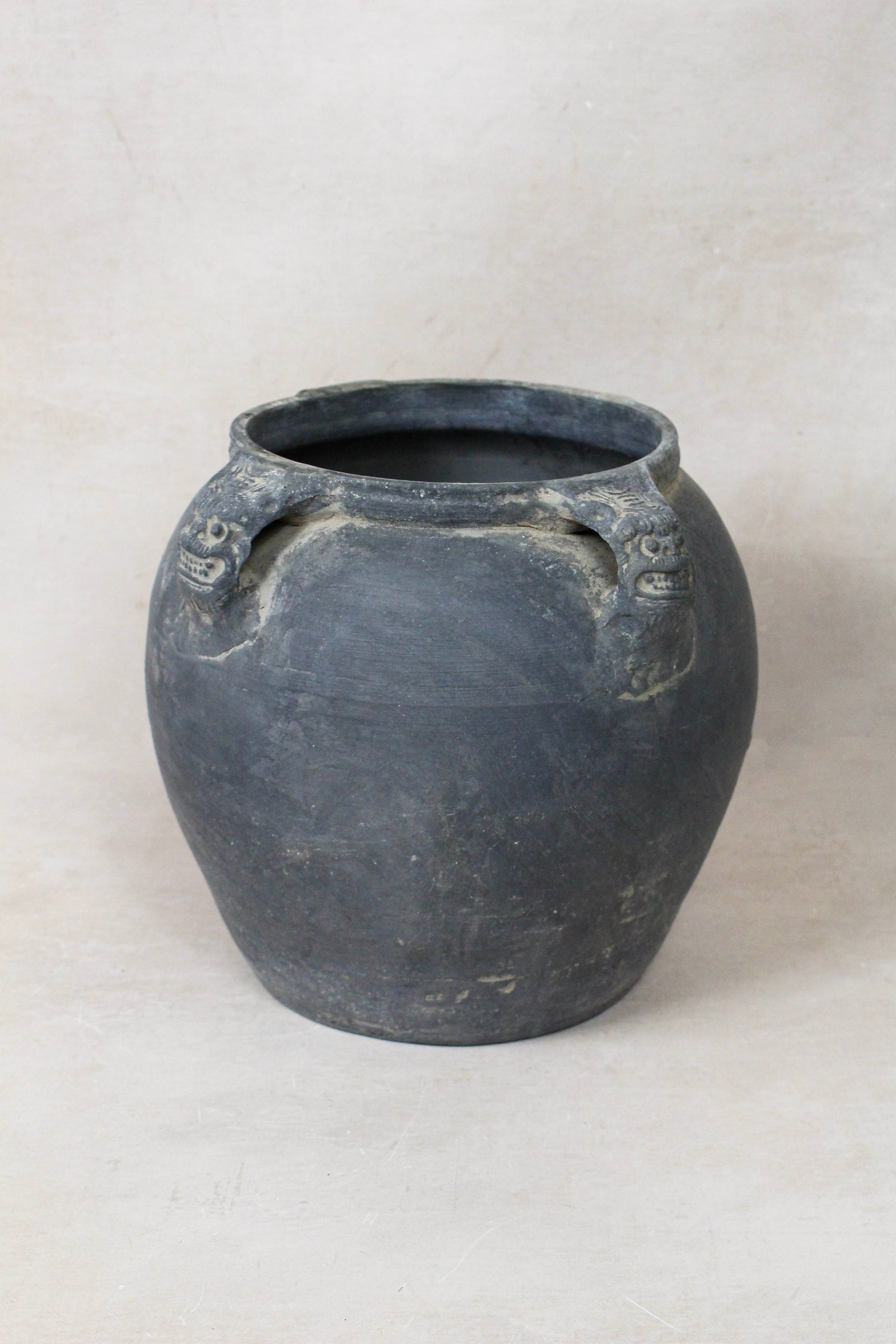 Vintage dark unglazed earthenware pot with lion-ear handles from Shanxi, China