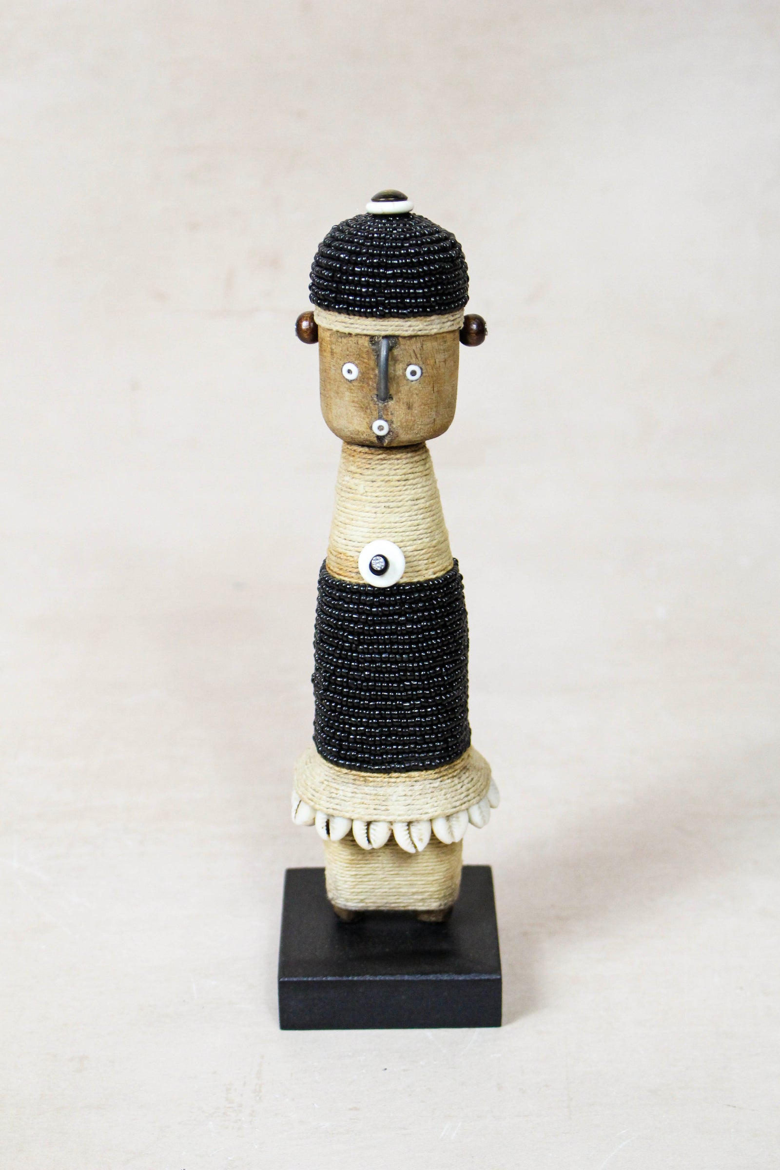 Hand-carved black beaded Namji doll from Cameroon
