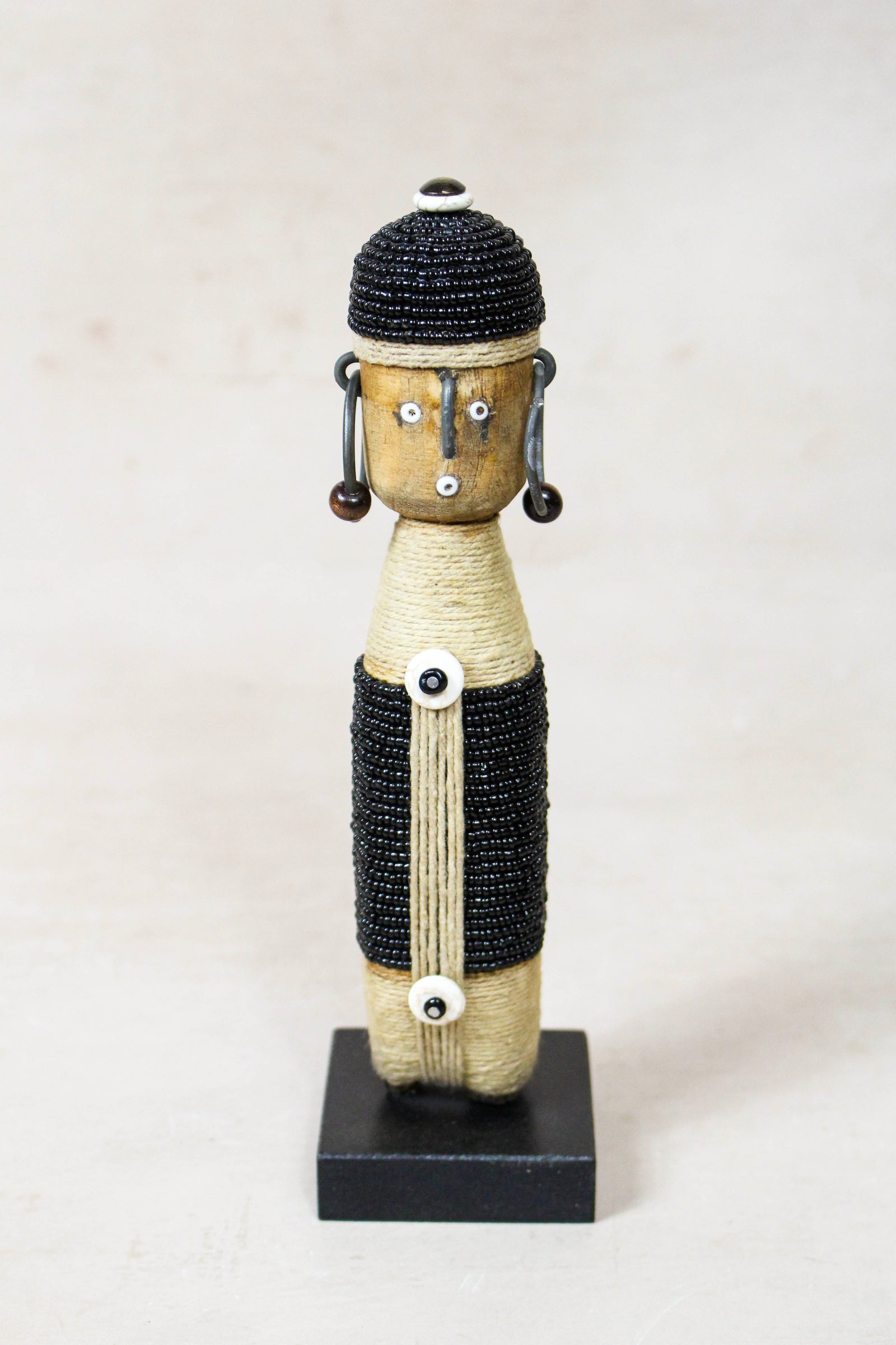 Hand-carved black beaded Namji doll from Cameroon