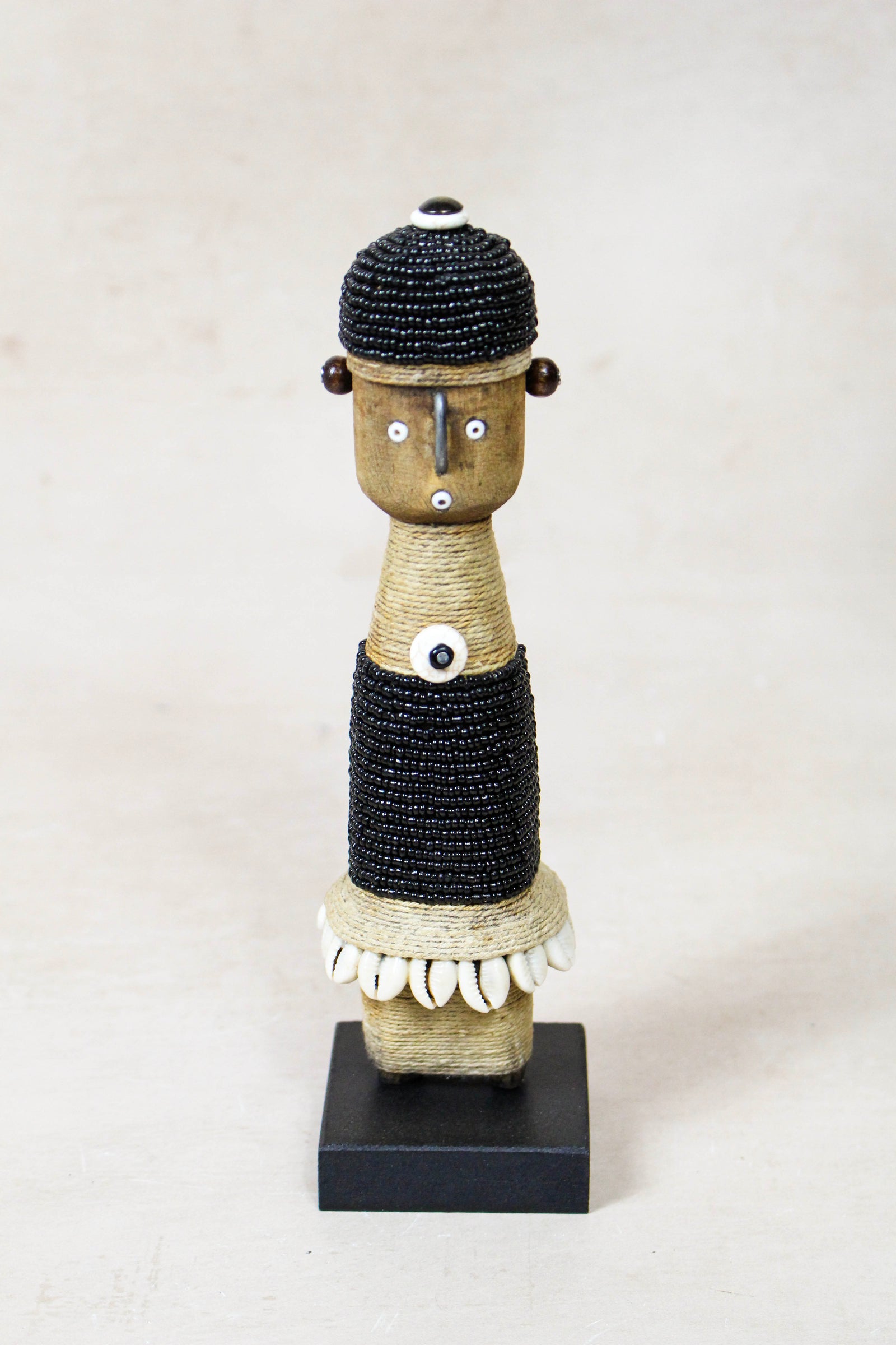 Hand-carved black beaded Namji doll from Cameroon