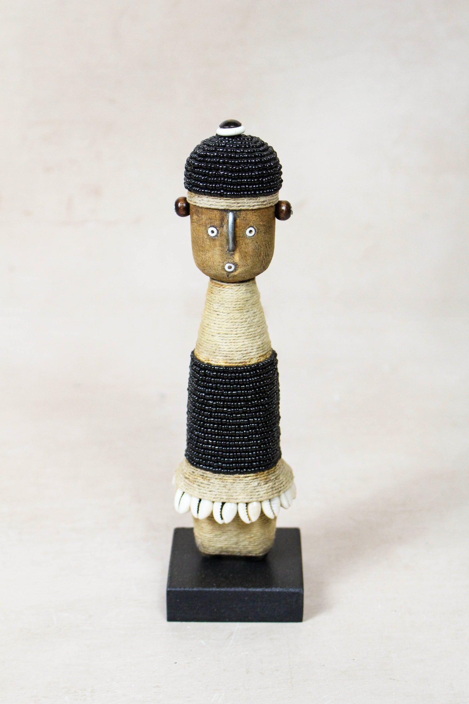 Hand-carved black beaded Namji doll from Cameroon