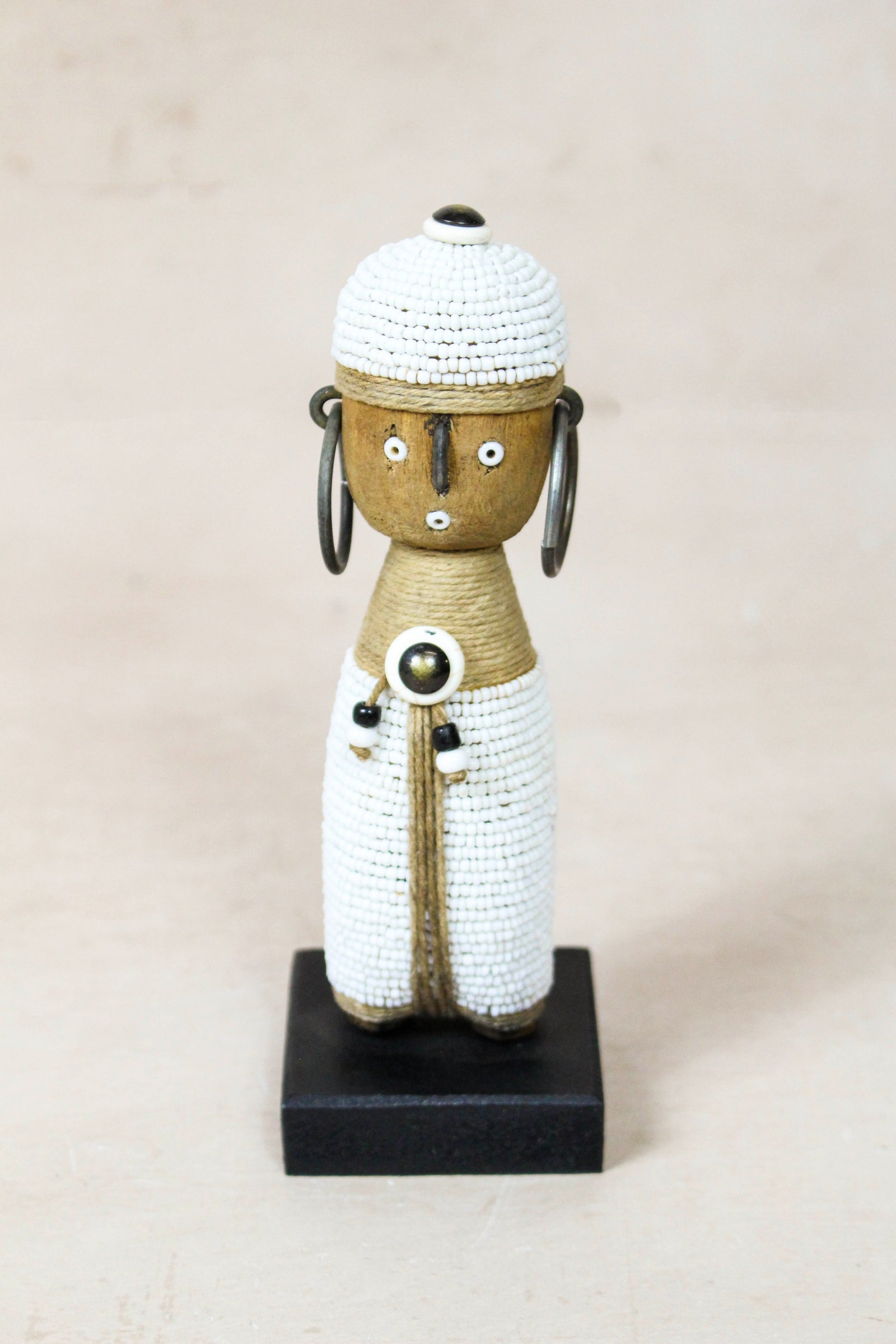 Small hand-carved white beaded Namji doll from Cameroon