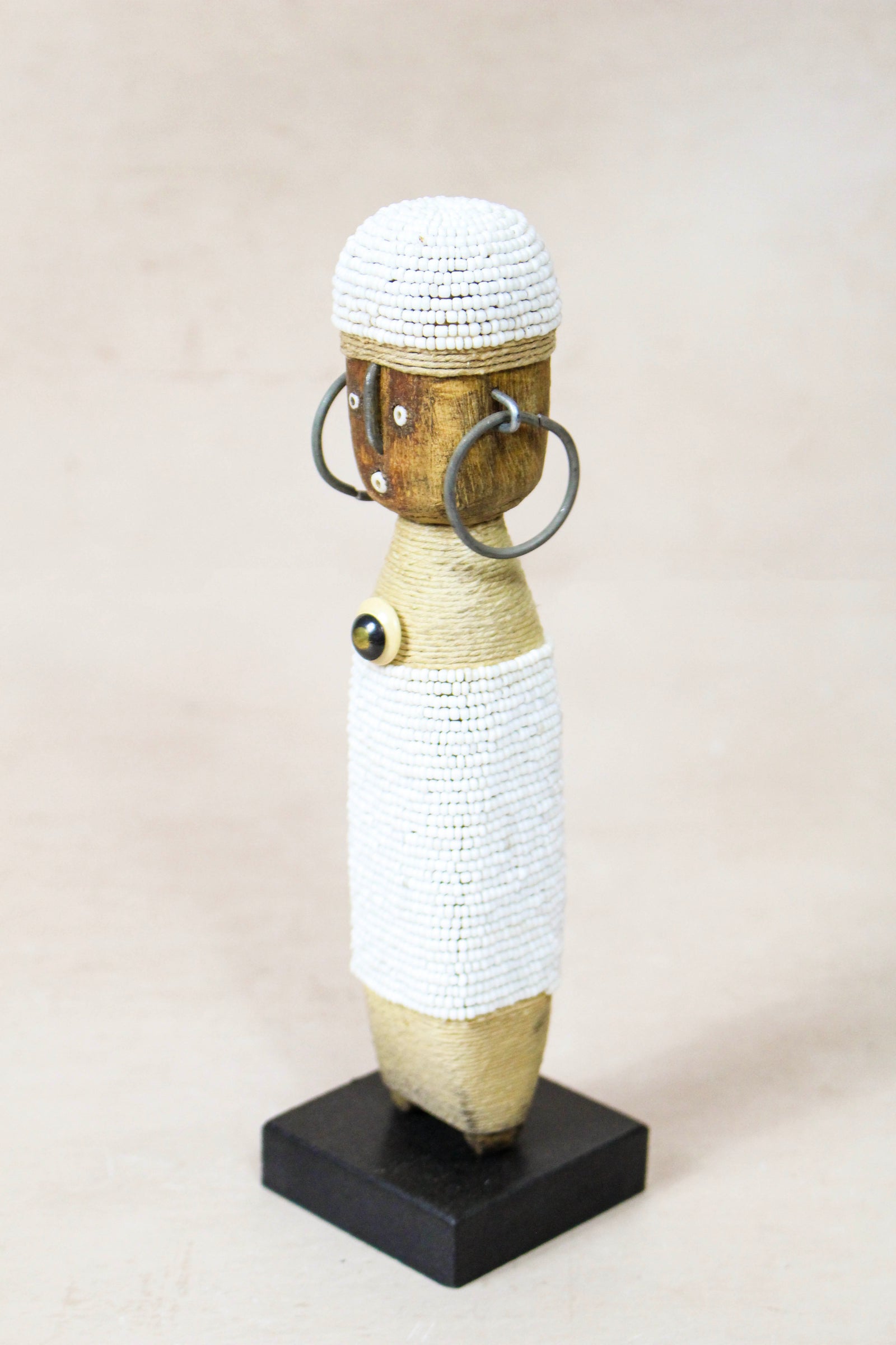 Hand-carved white beaded Namji doll from Cameroon