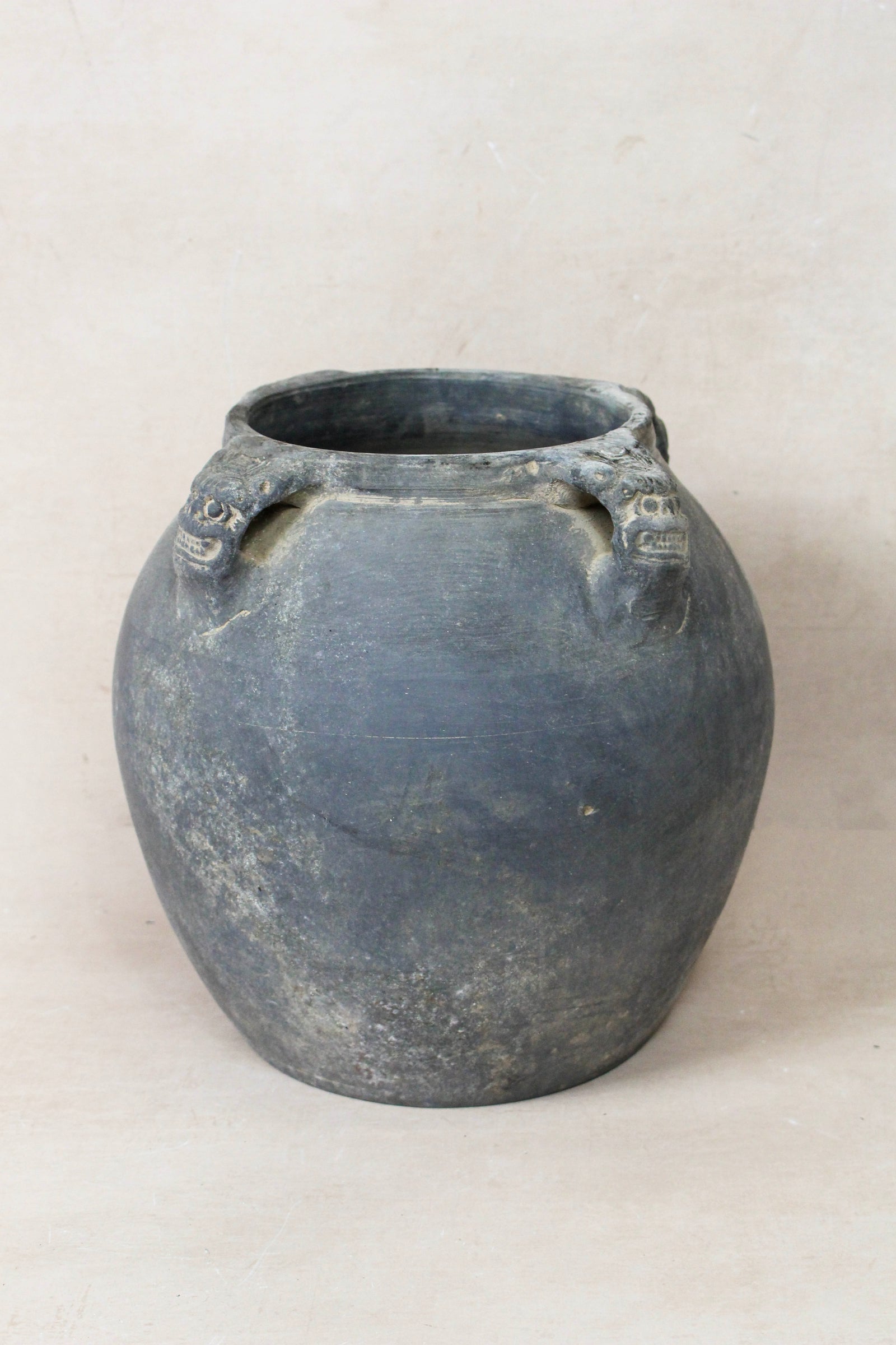 Vintage dark unglazed earthenware pot with lion-ear handles from Shanxi, China