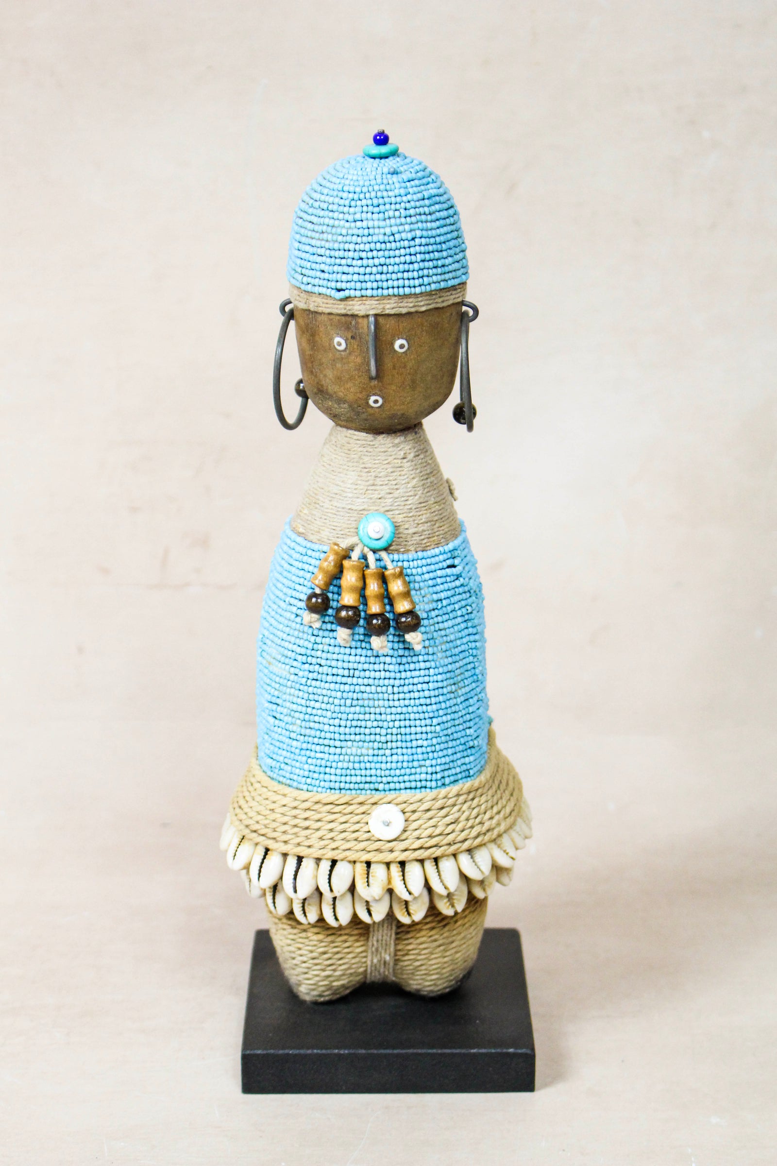 Hand-carved light blue beaded Namji doll from Cameroon