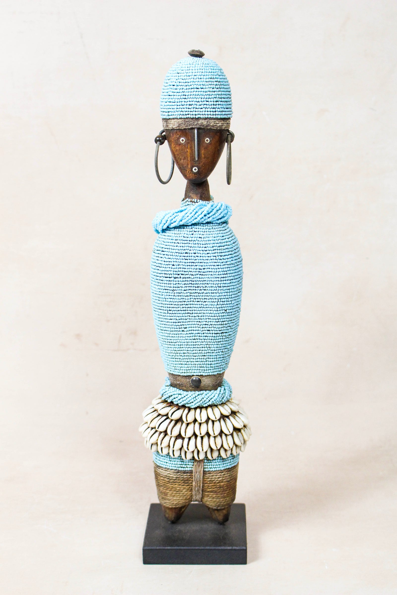 Hand-carved light blue beaded Namji doll from Cameroon
