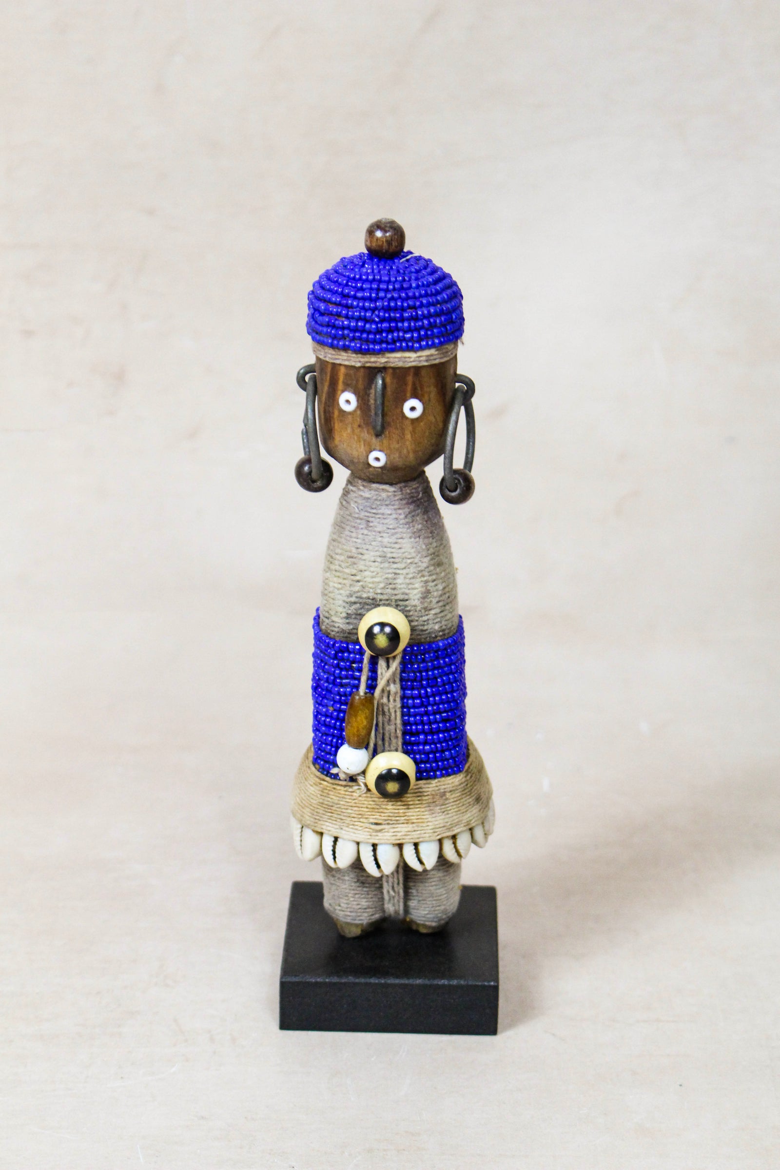 Hand-carved dark blue beaded Namji doll from Cameroon