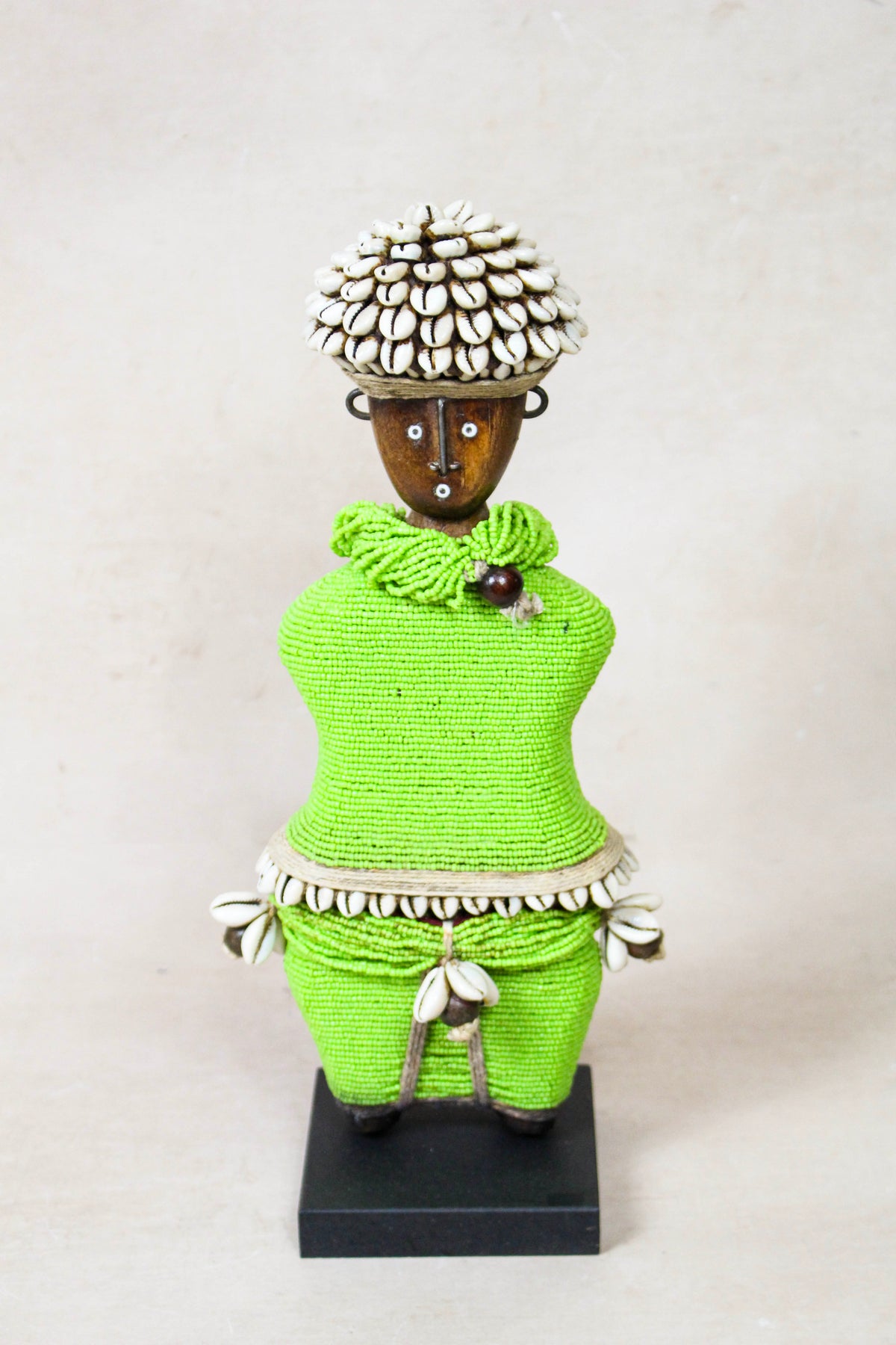 Hand-carved green beaded Namji doll from Cameroon