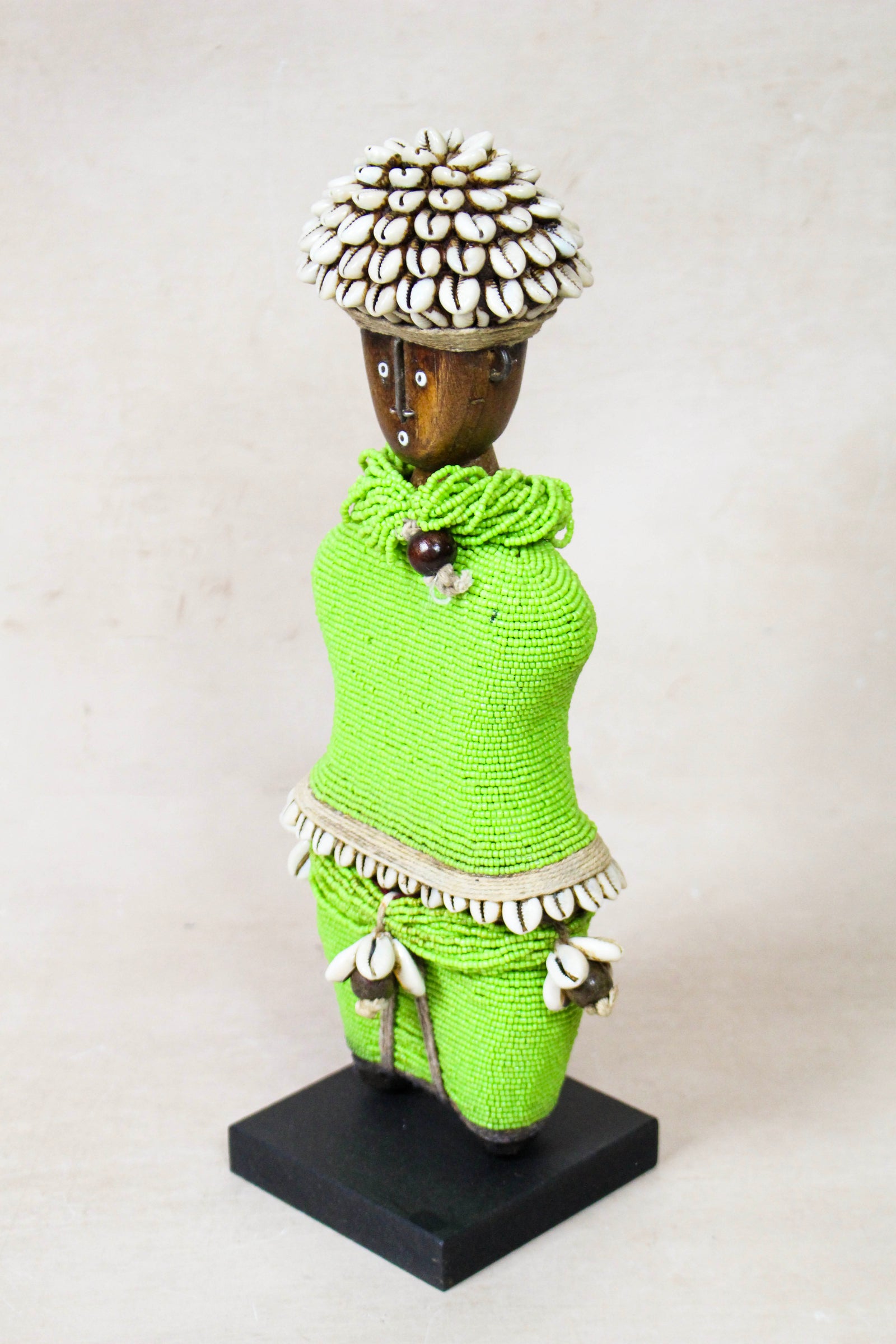 Hand-carved green beaded Namji doll from Cameroon