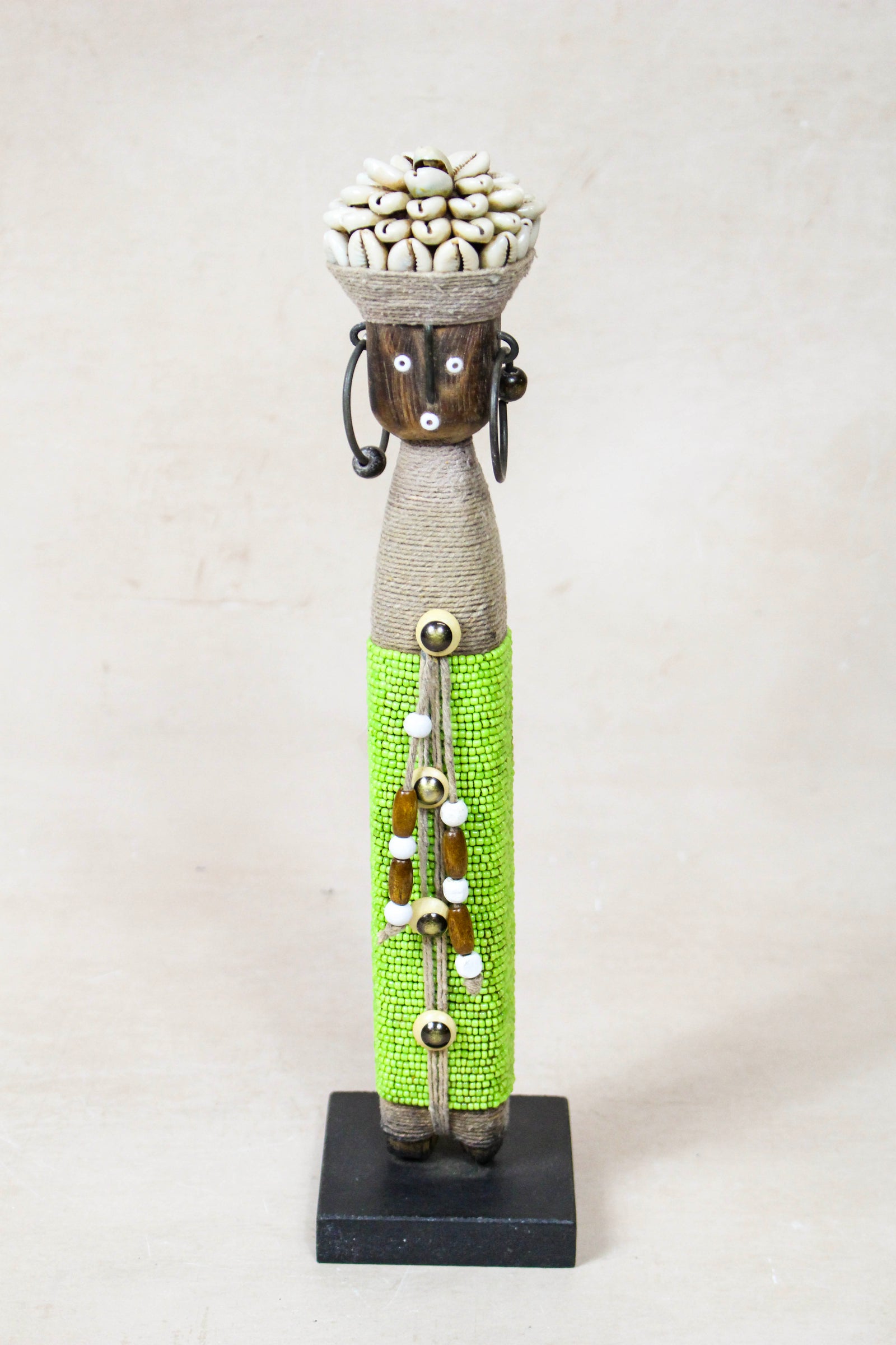 Hand-carved green beaded Namji doll from Cameroon