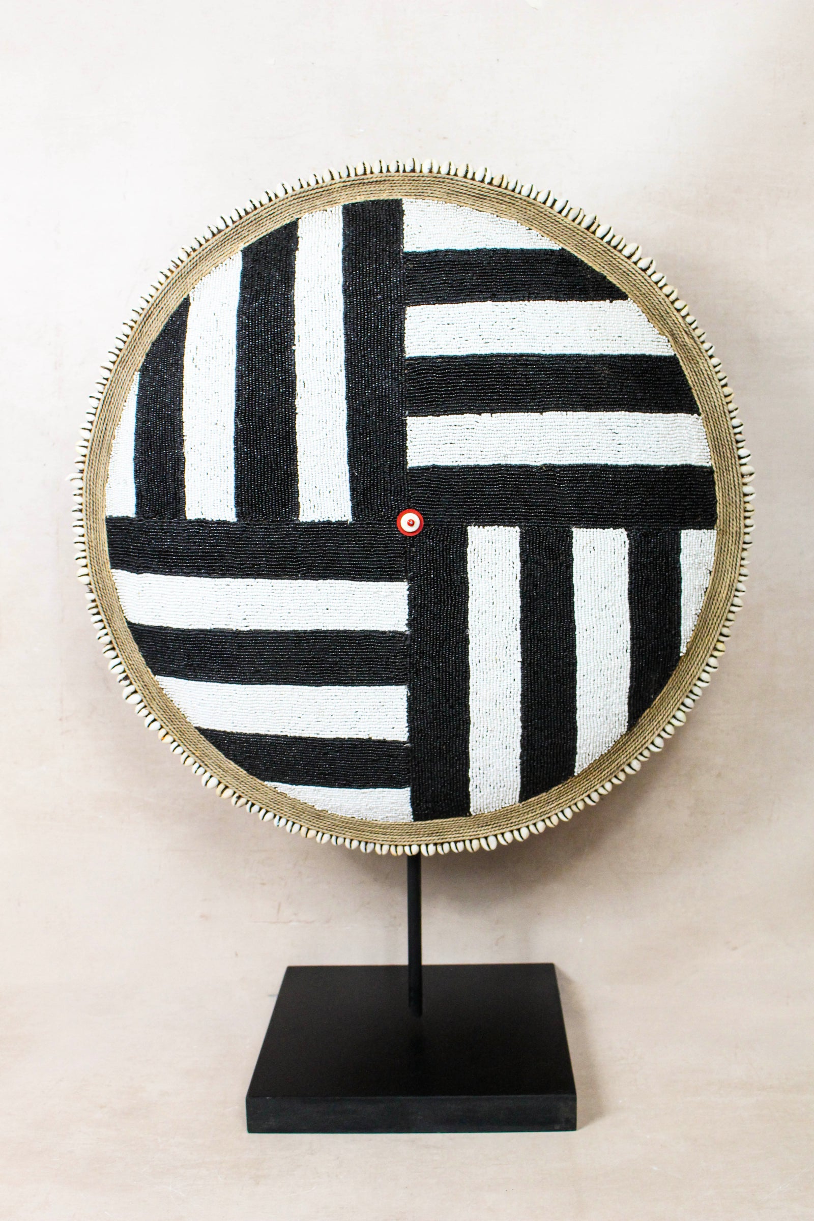 Cameroon beaded shield with central cowrie cluster, handcrafted Tikar Baobab-wood shield