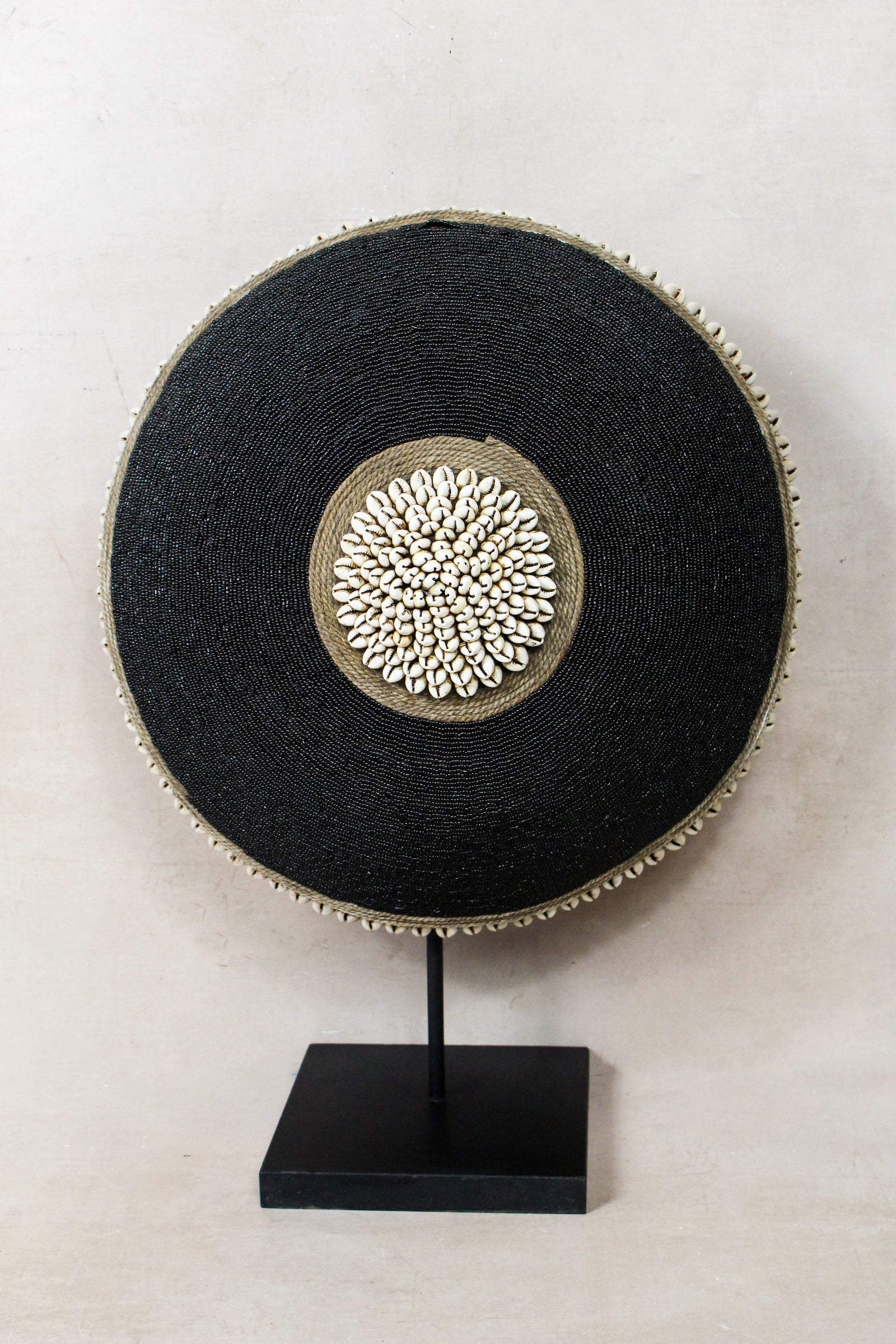 Cameroon beaded shield with central cowrie cluster, handcrafted Tikar Baobab-wood shield