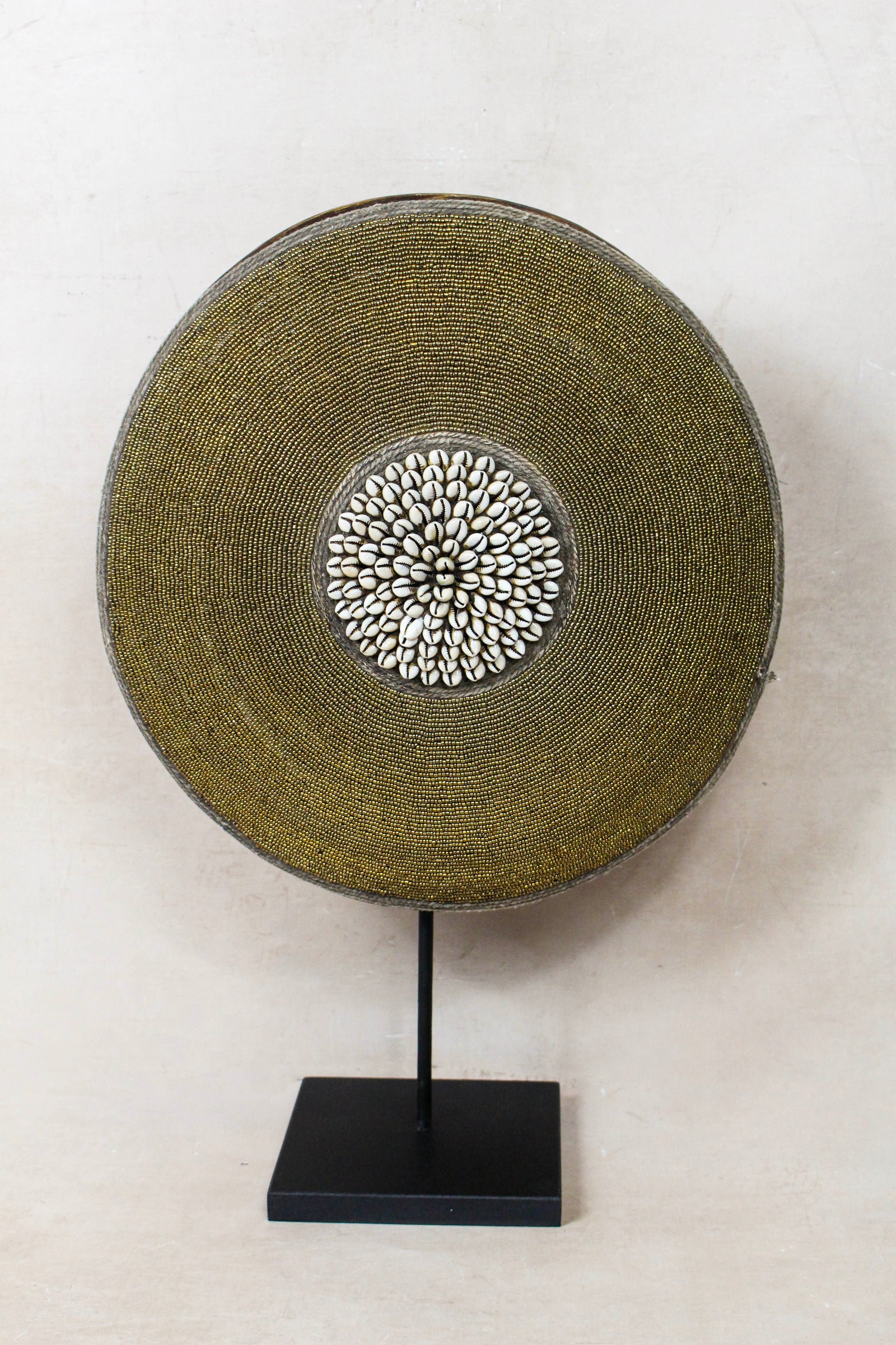 Cameroon beaded shield with central cowrie cluster, handcrafted Tikar Baobab-wood shield