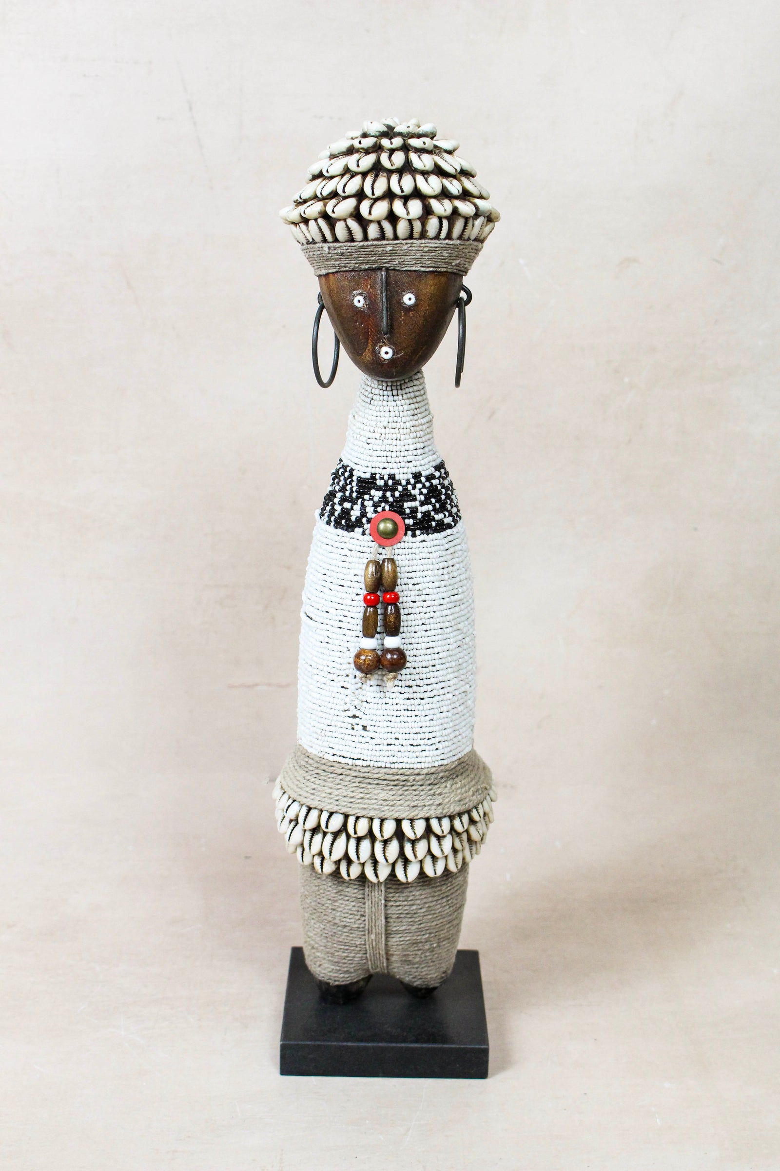Hand-carved white beaded Namji doll from Cameroon