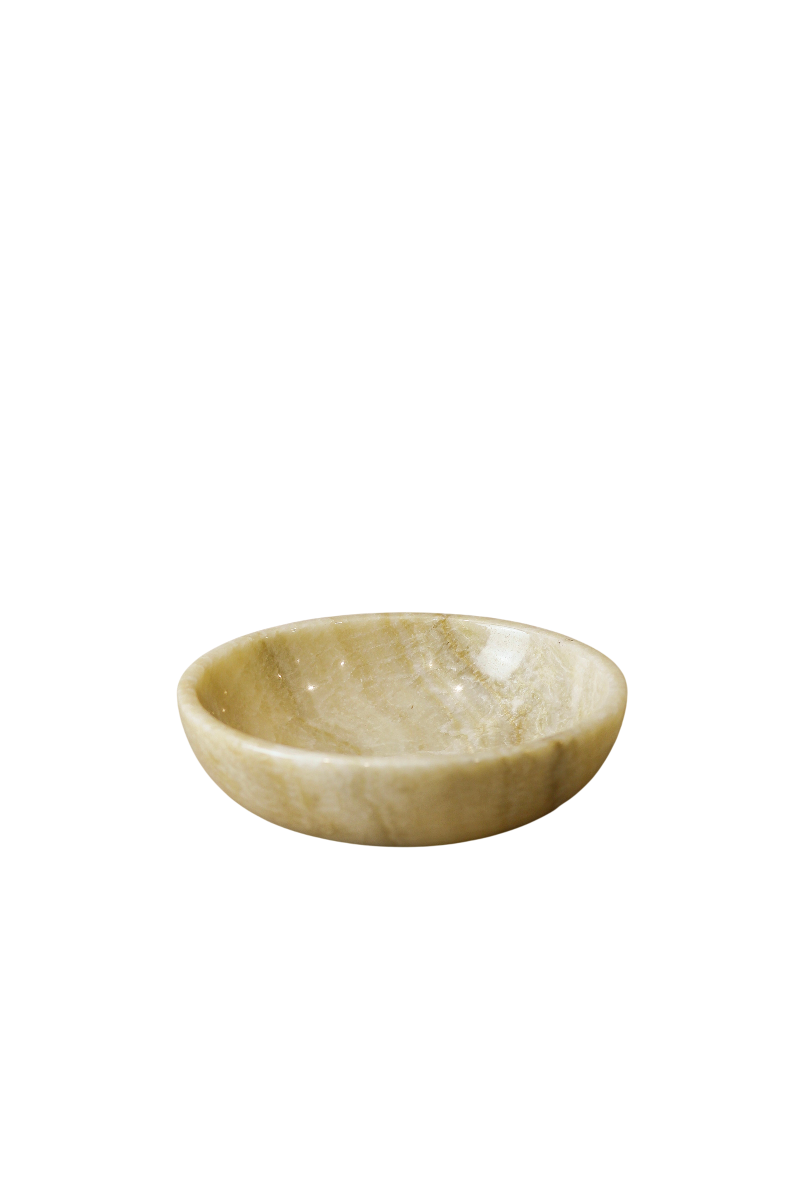 Polished onyx bowl with natural veining in warm earthy tones