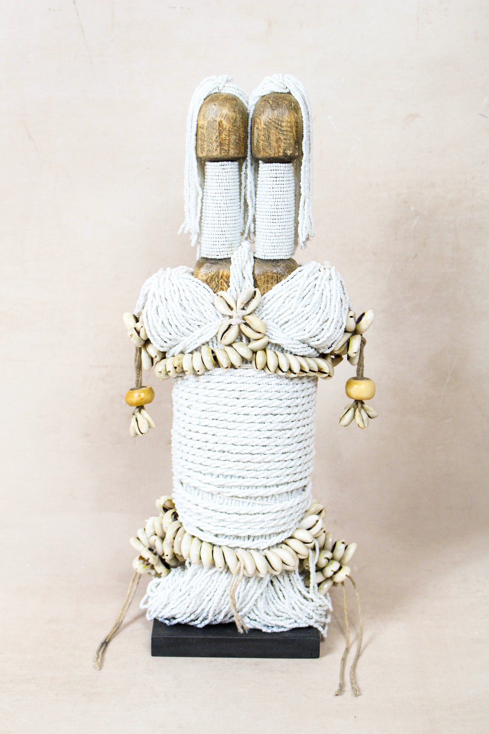 Hand-carved white beaded Namji doll from Cameroon