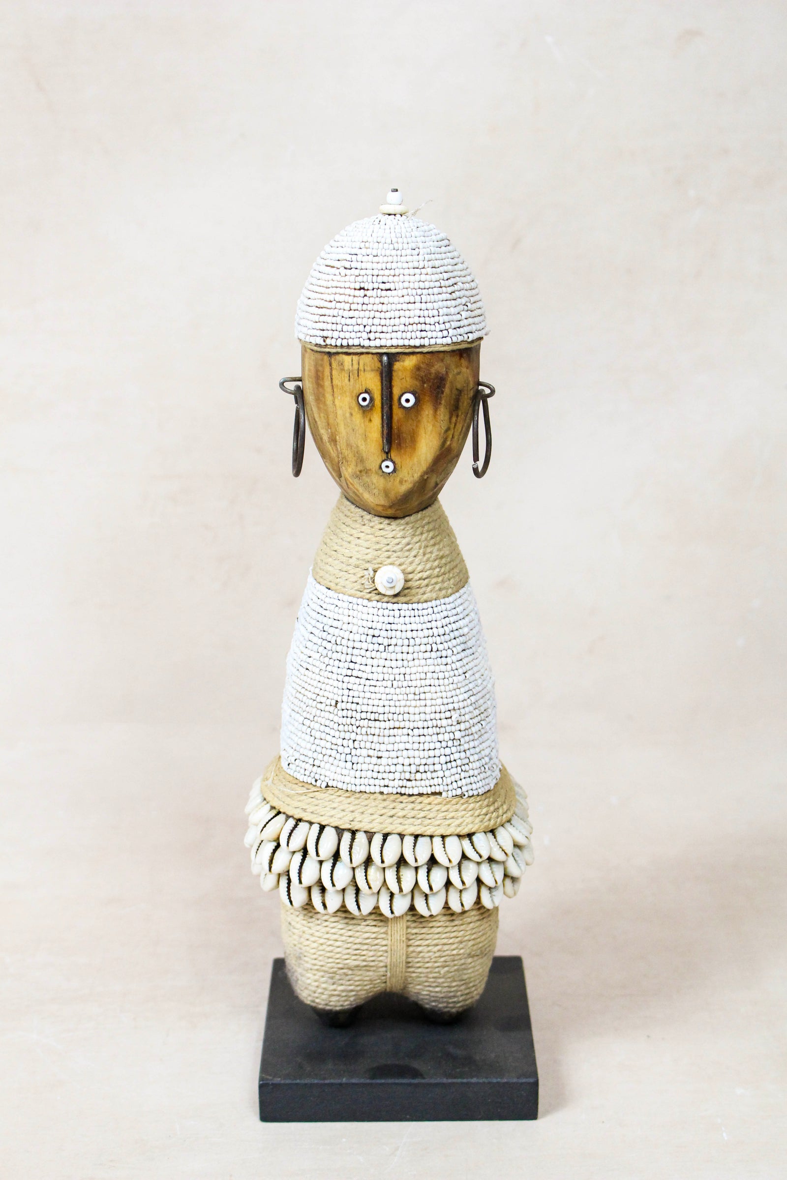 Hand-carved white beaded Namji doll from Cameroon