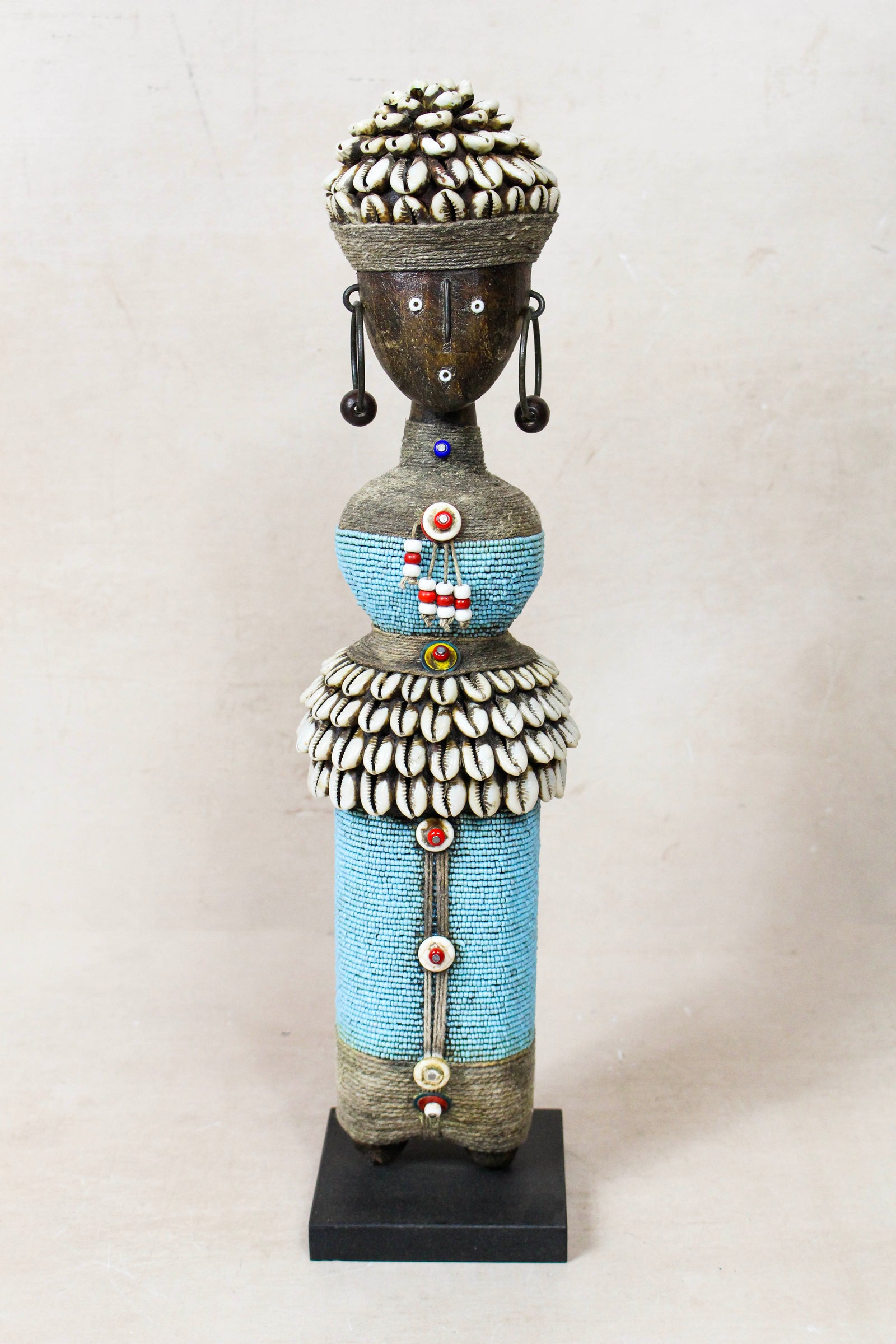 Hand-carved light blue beaded Namji doll from Cameroon