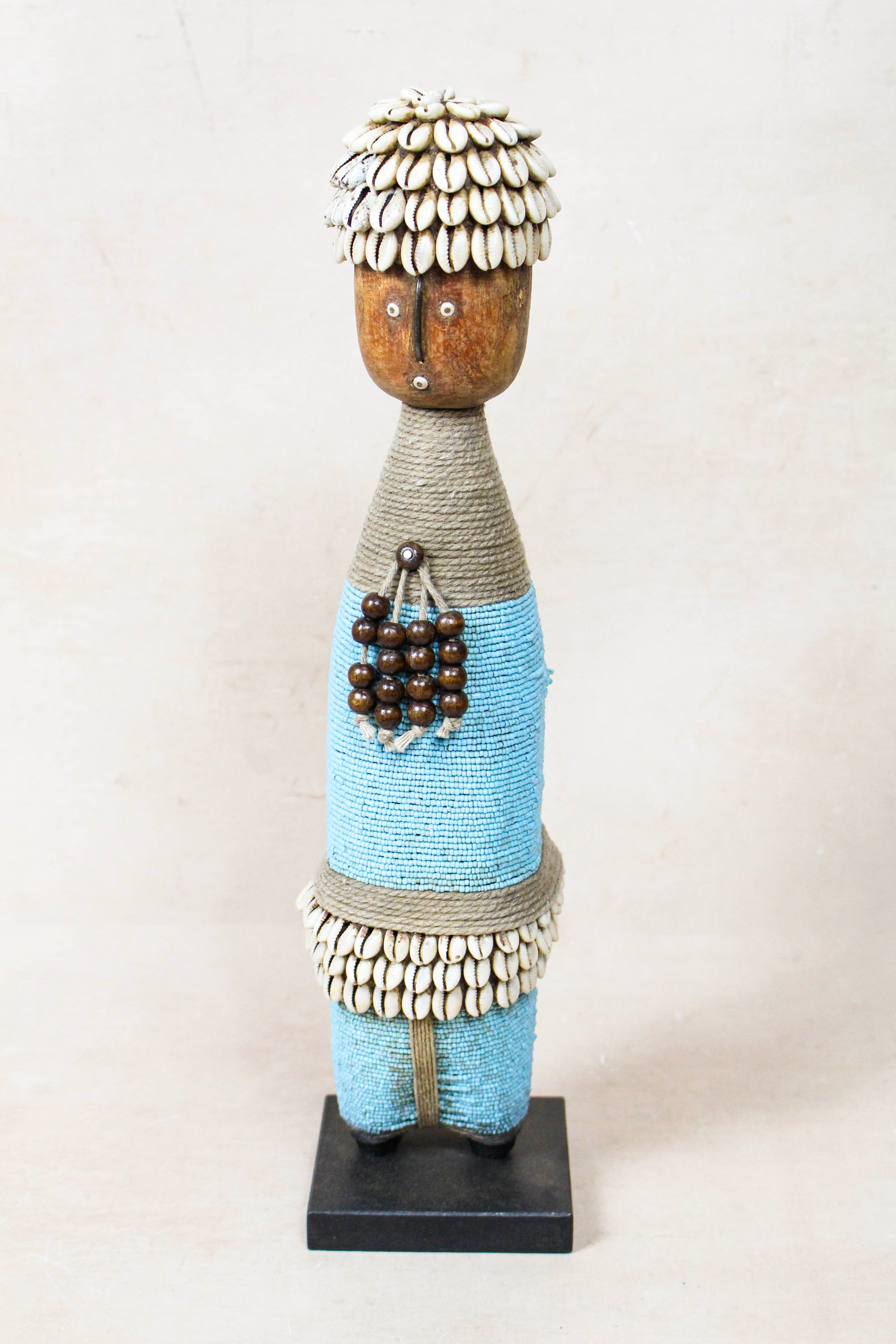 Hand-carved light blue beaded Namji doll from Cameroon