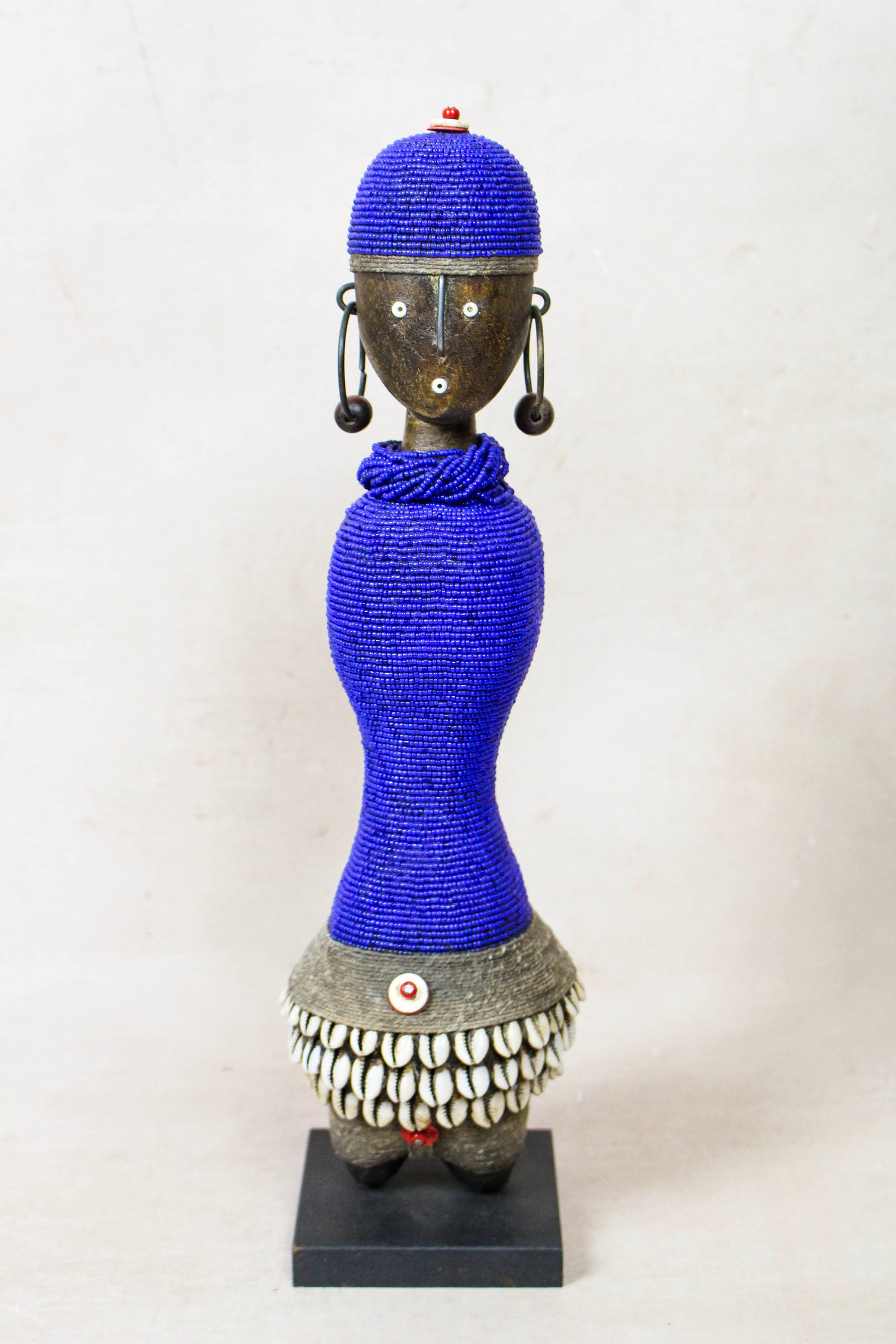 Hand-carved dark blue beaded Namji doll from Cameroon