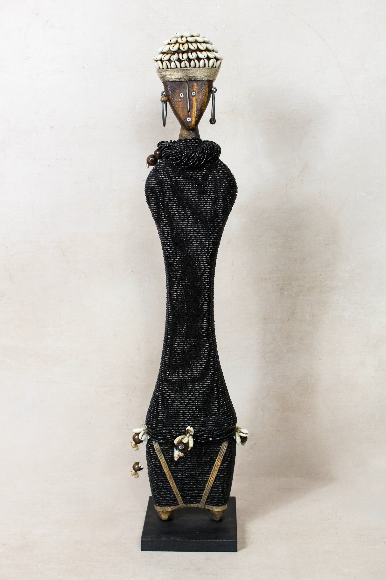 Large hand-carved black beaded Namji doll from Cameroon