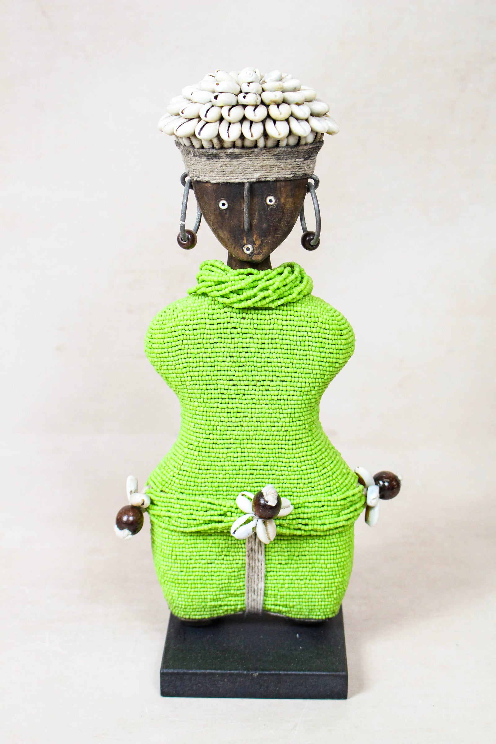 Hand-carved green beaded Namji doll from Cameroon