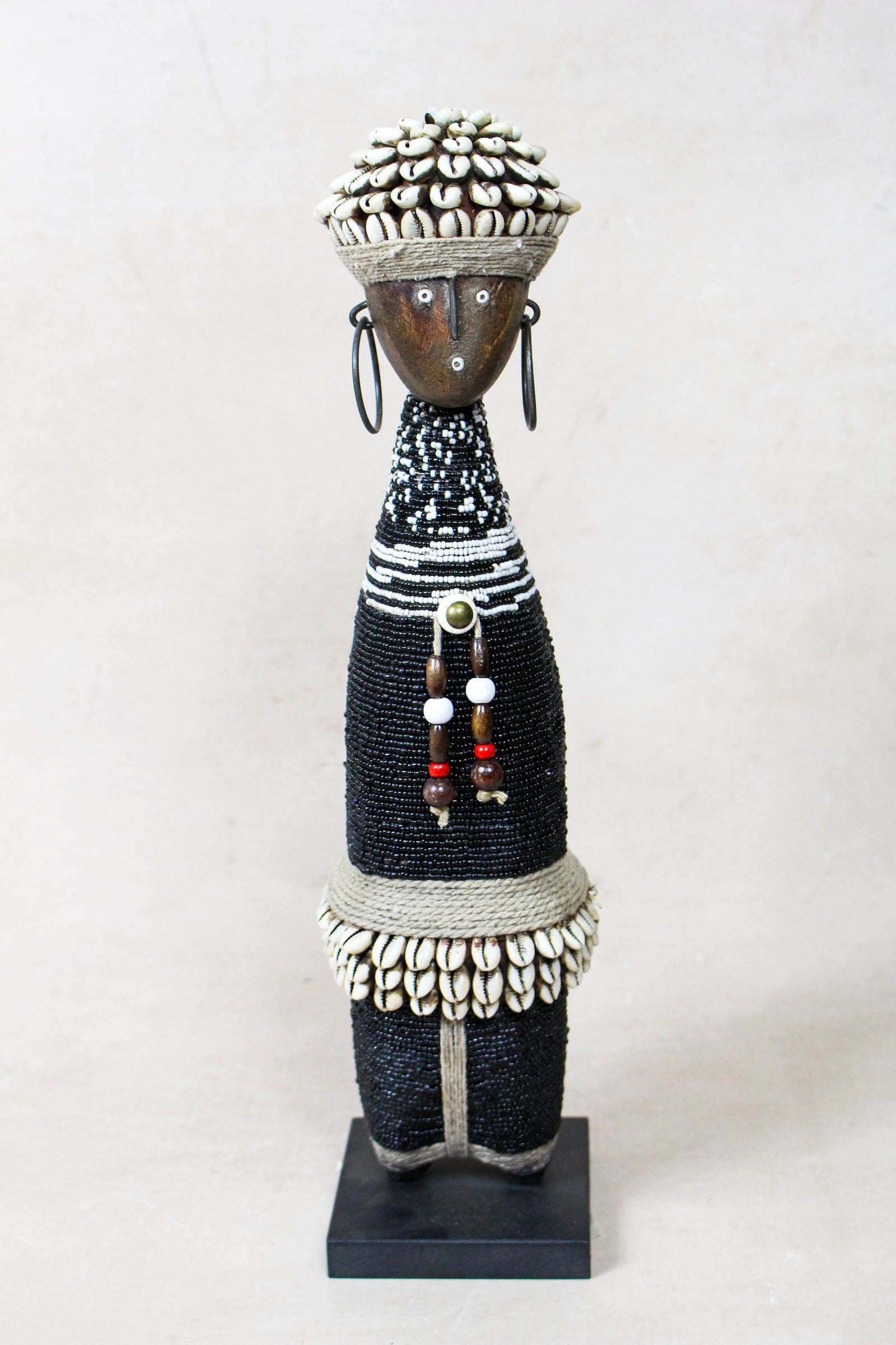 Hand-carved black beaded Namji doll from Cameroon