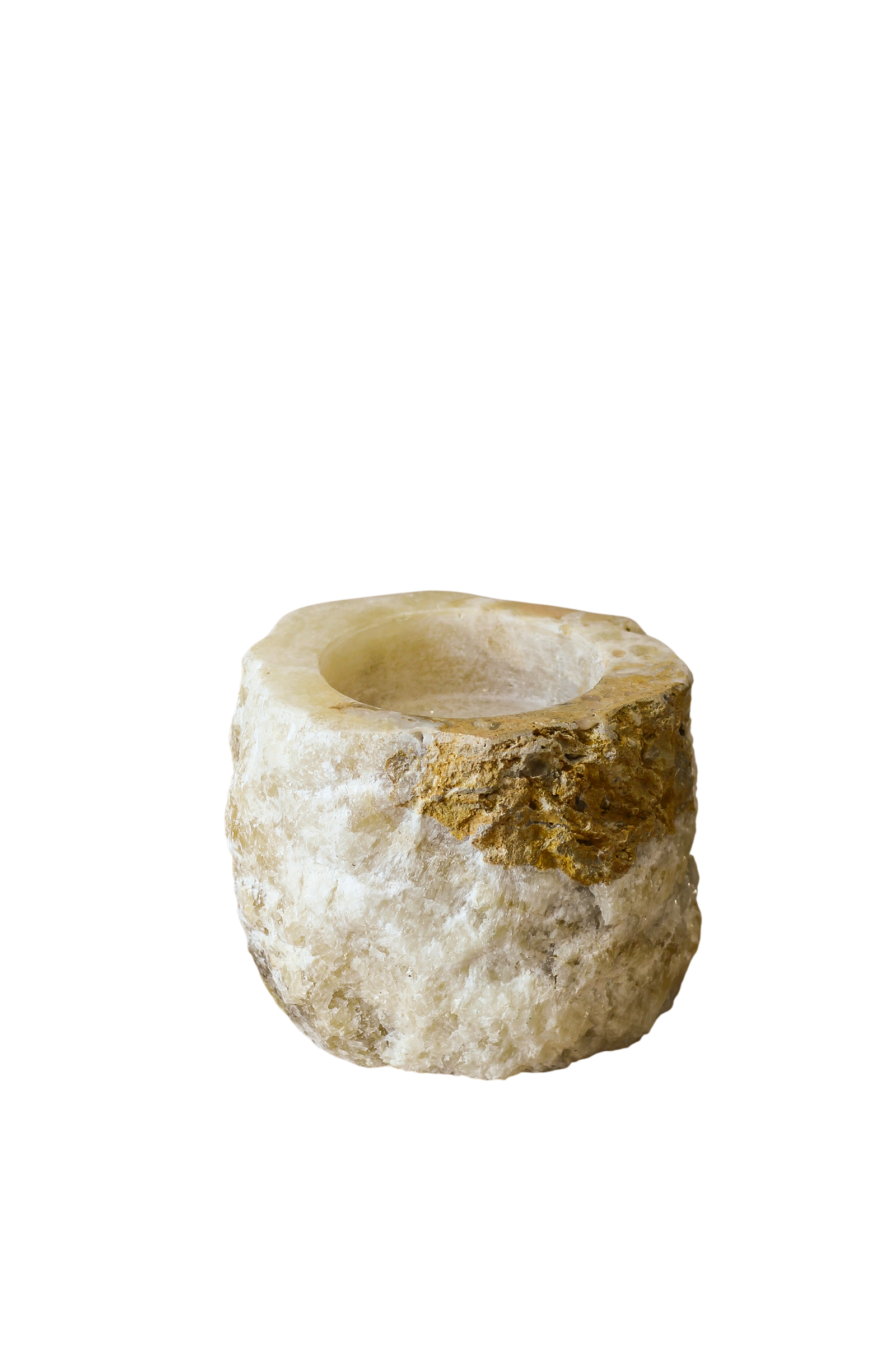 Rough-cut onyx candle holder with polished top and raw natural sides