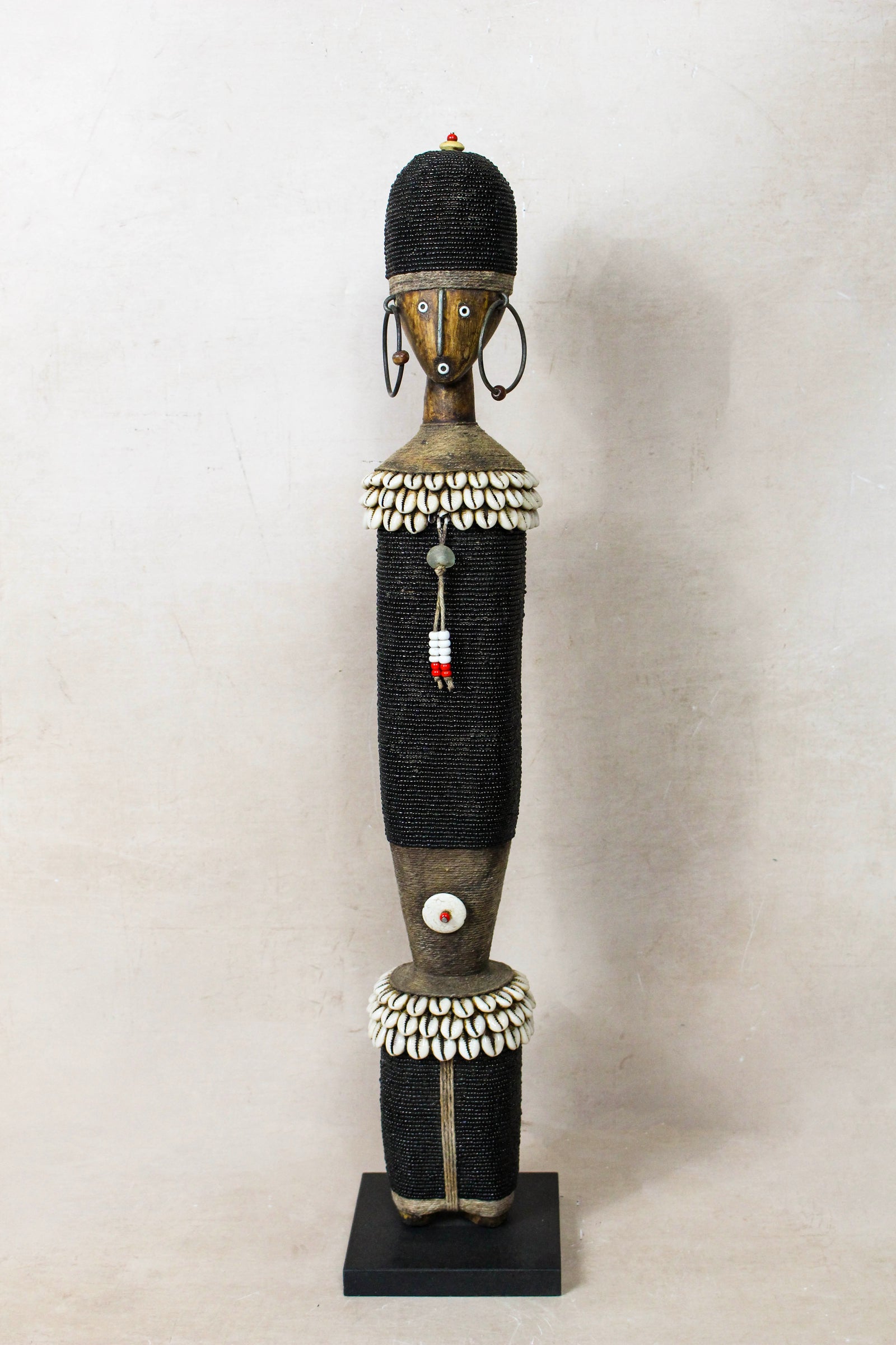 Large hand-carved black beaded Namji doll from Cameroon