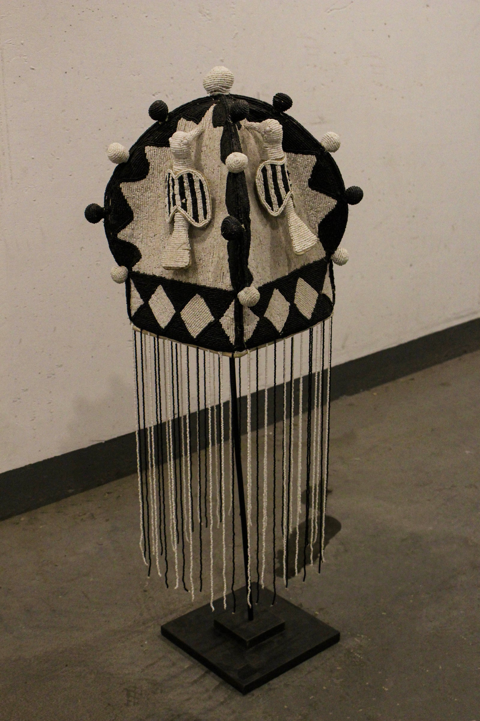 Yoruba royal beaded crown in black and white, side view