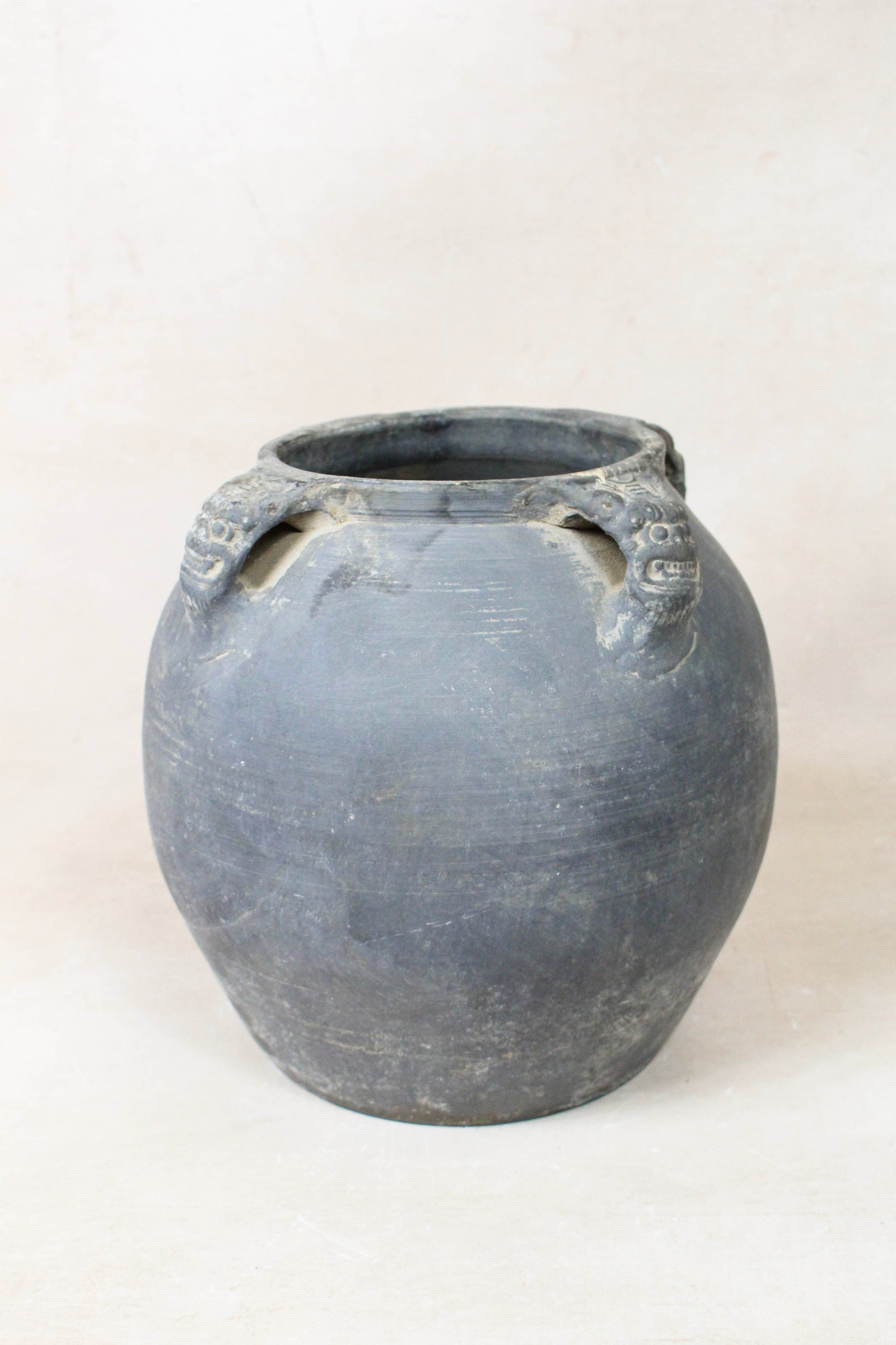 Vintage dark unglazed earthenware pot with lion-ear handles from Shanxi, China