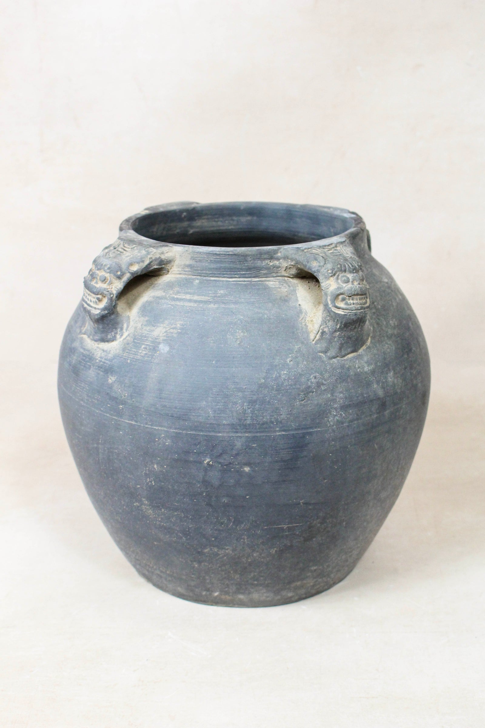 Vintage dark unglazed earthenware pot with lion-ear handles from Shanxi, China