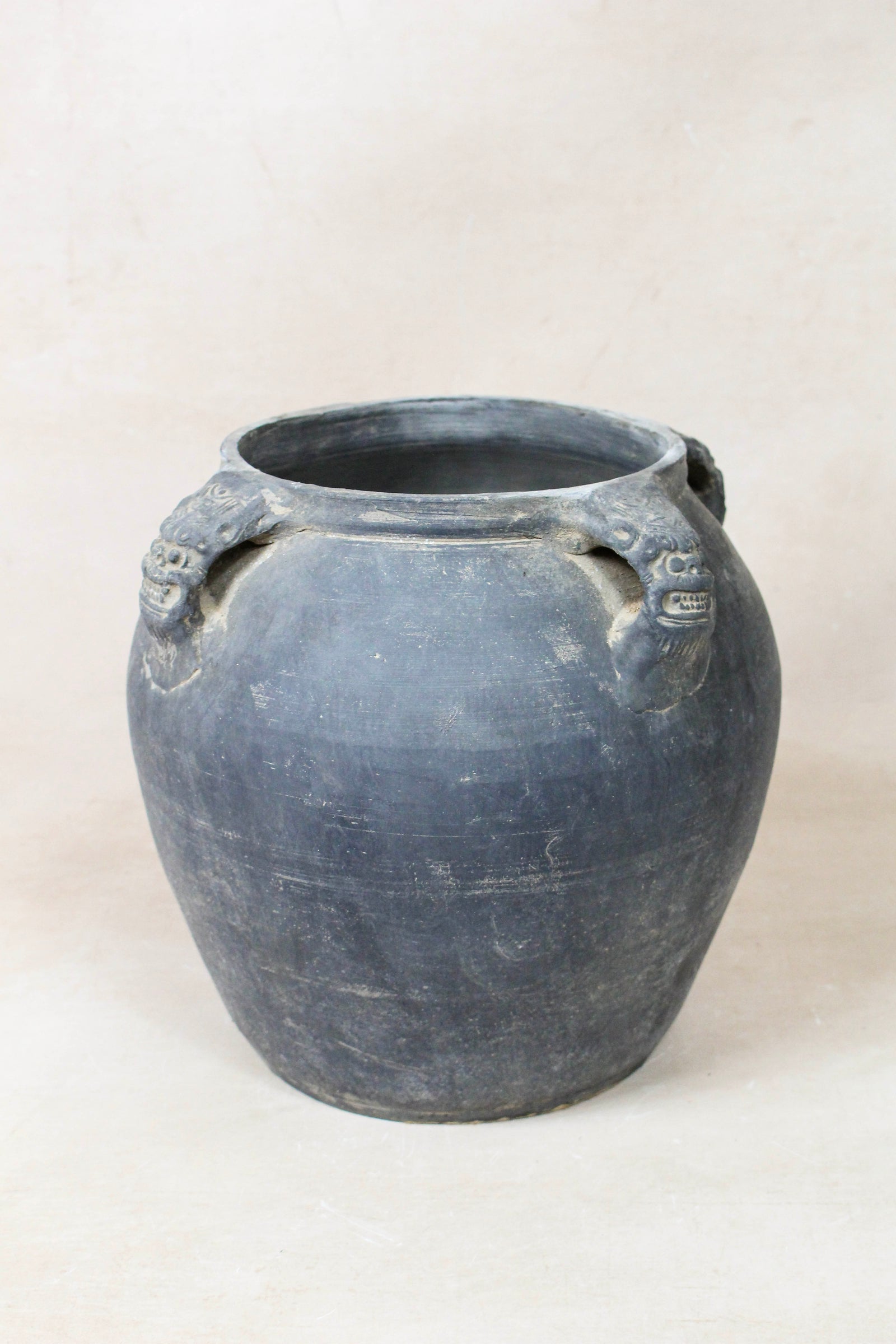 Vintage dark unglazed earthenware pot with lion-ear handles from Shanxi, China