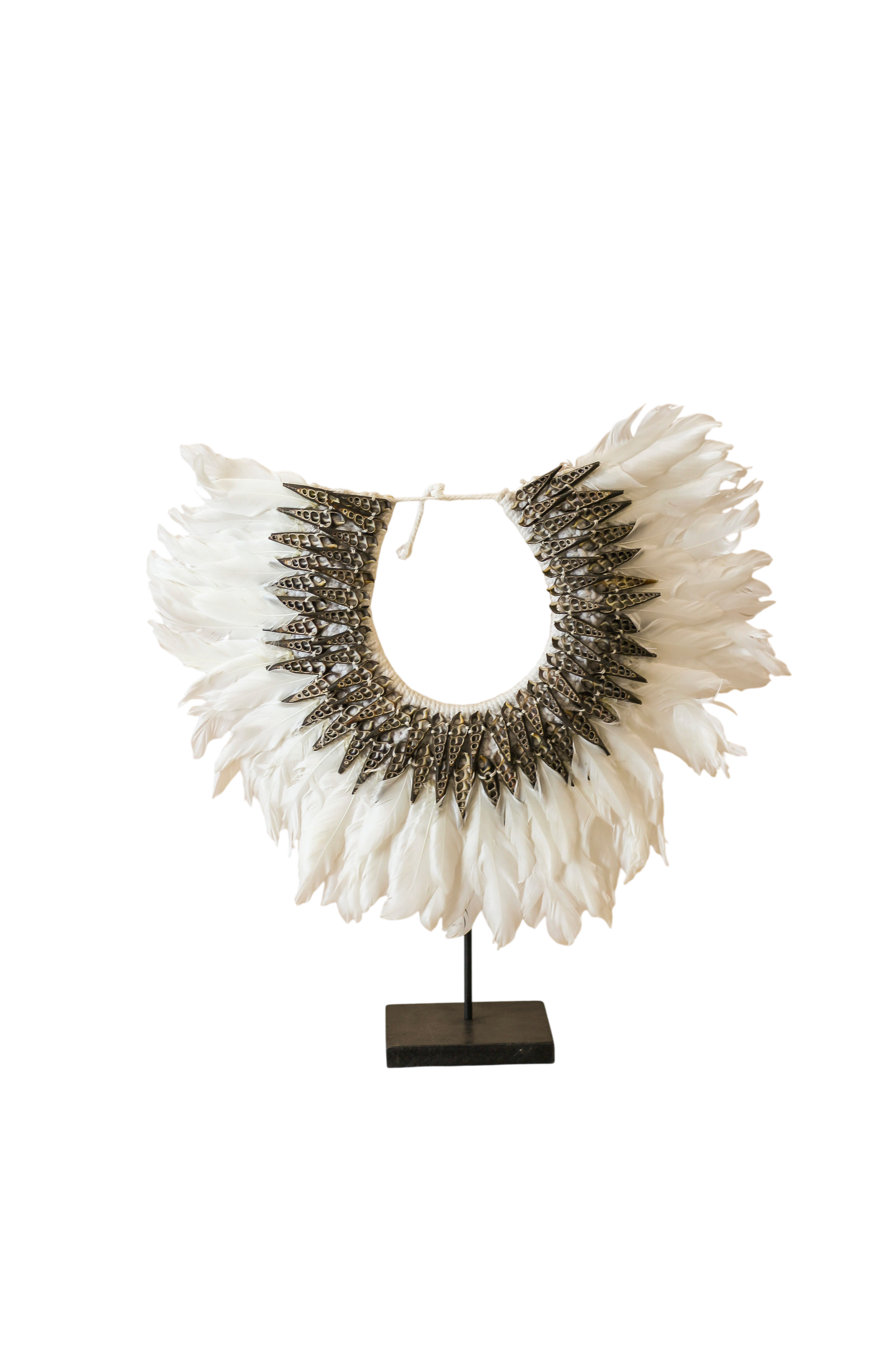 Handmade Indonesian feather and shell necklace on a display stand