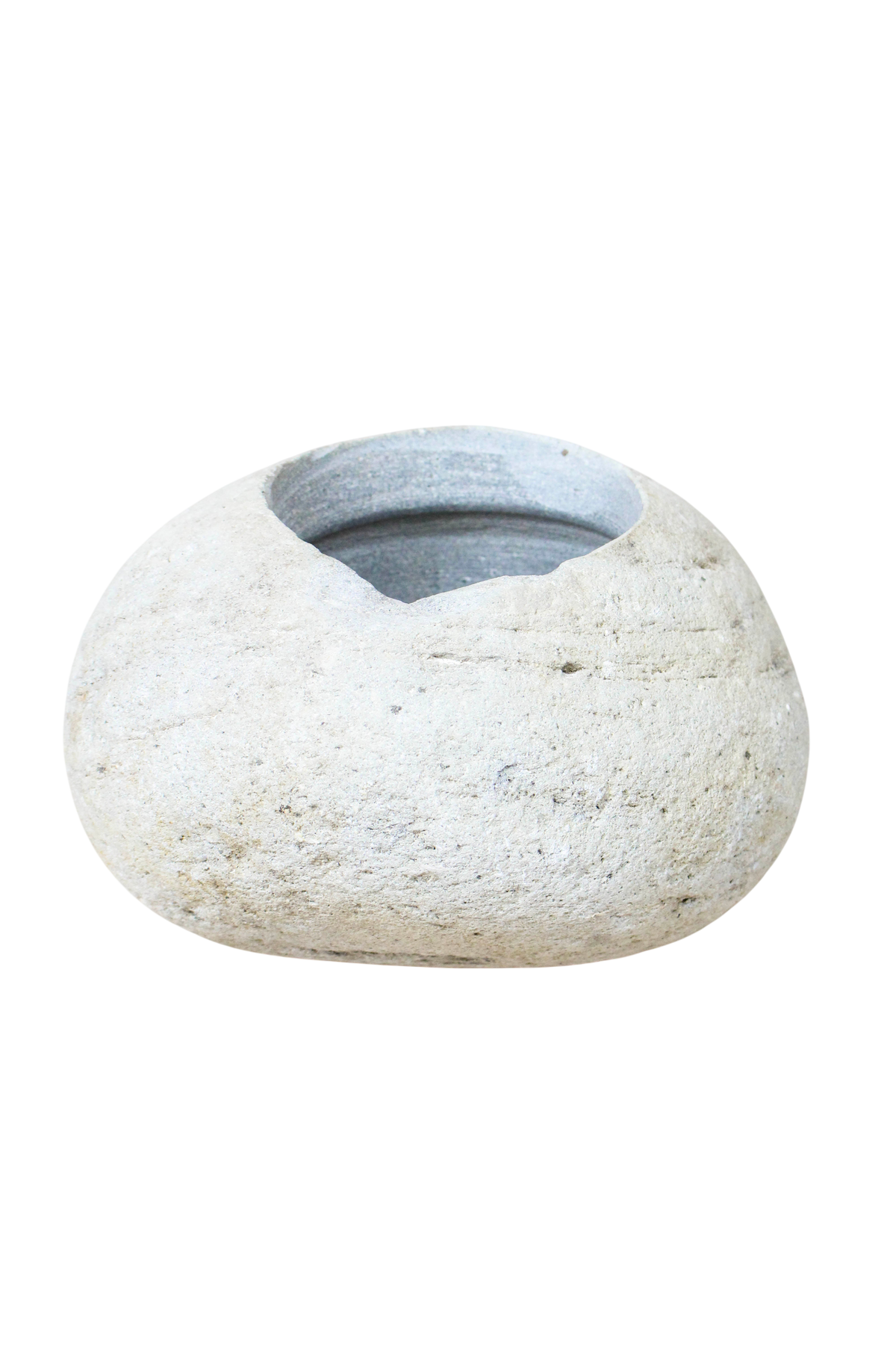 Planter hollowed by hand from a single smooth river stone, for direct planting