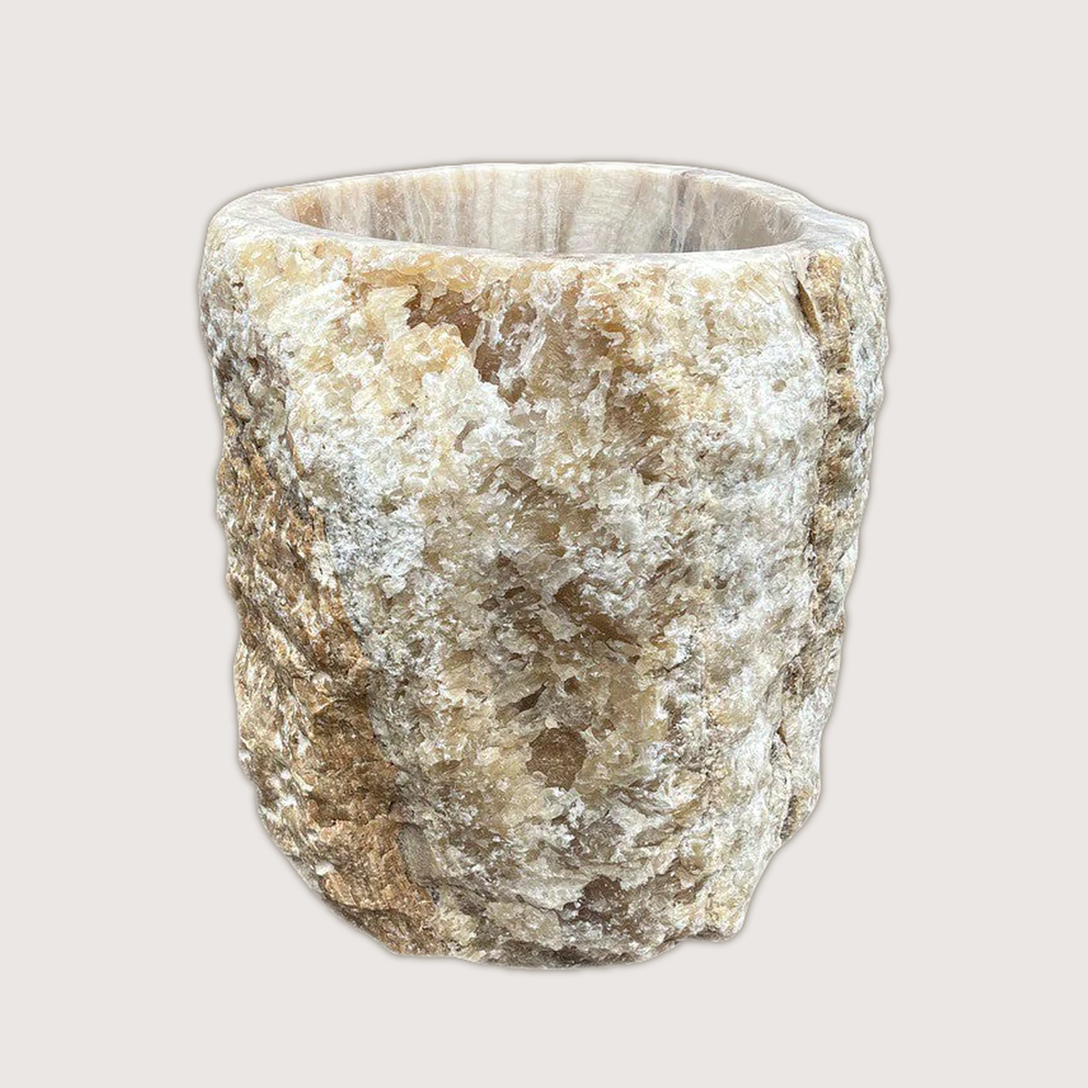 Large planter hand-carved from a single piece of raw onyx, the rugged natural outer edge left intact against a smoothly polished interior