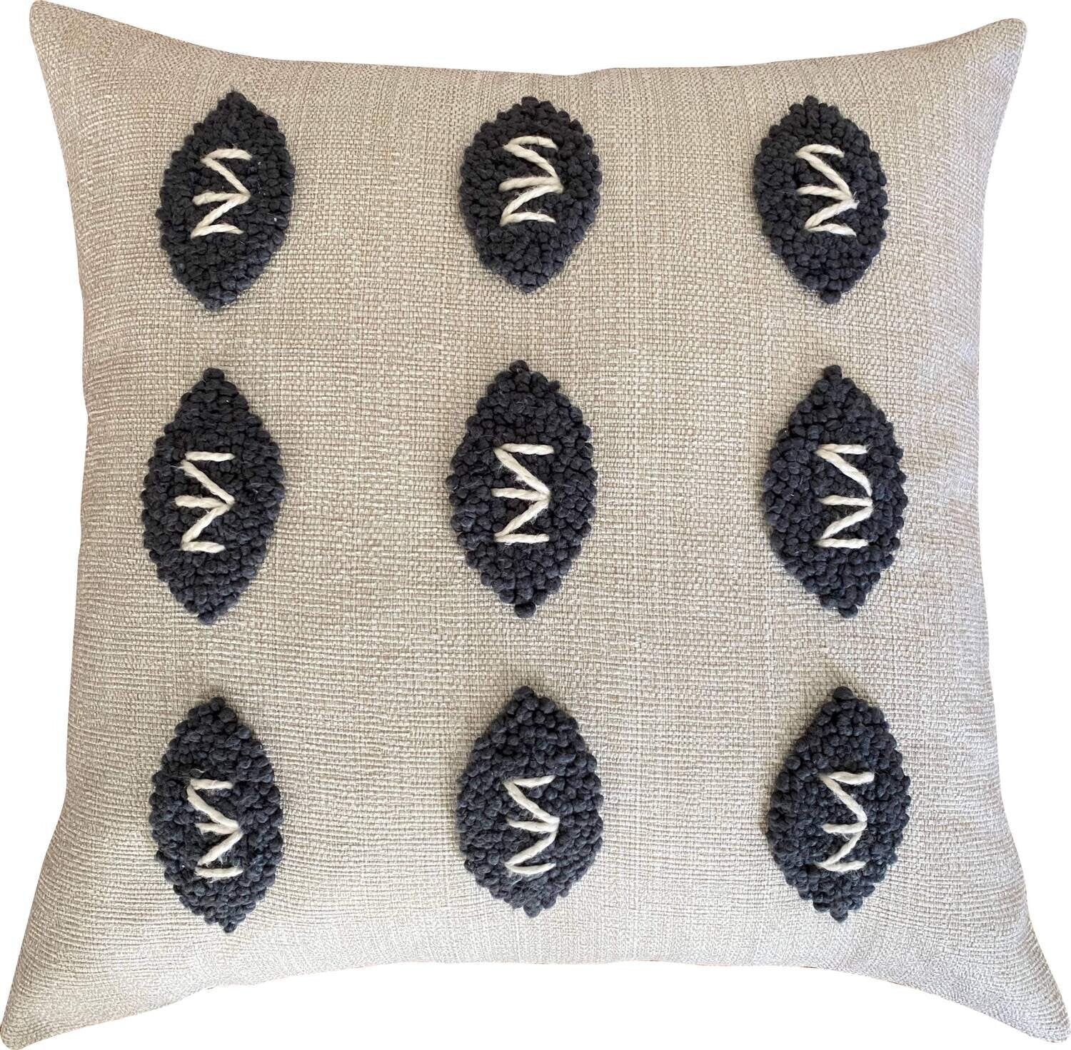Hand-punched Zulu-pattern cushion cover in oatmeal and charcoal
