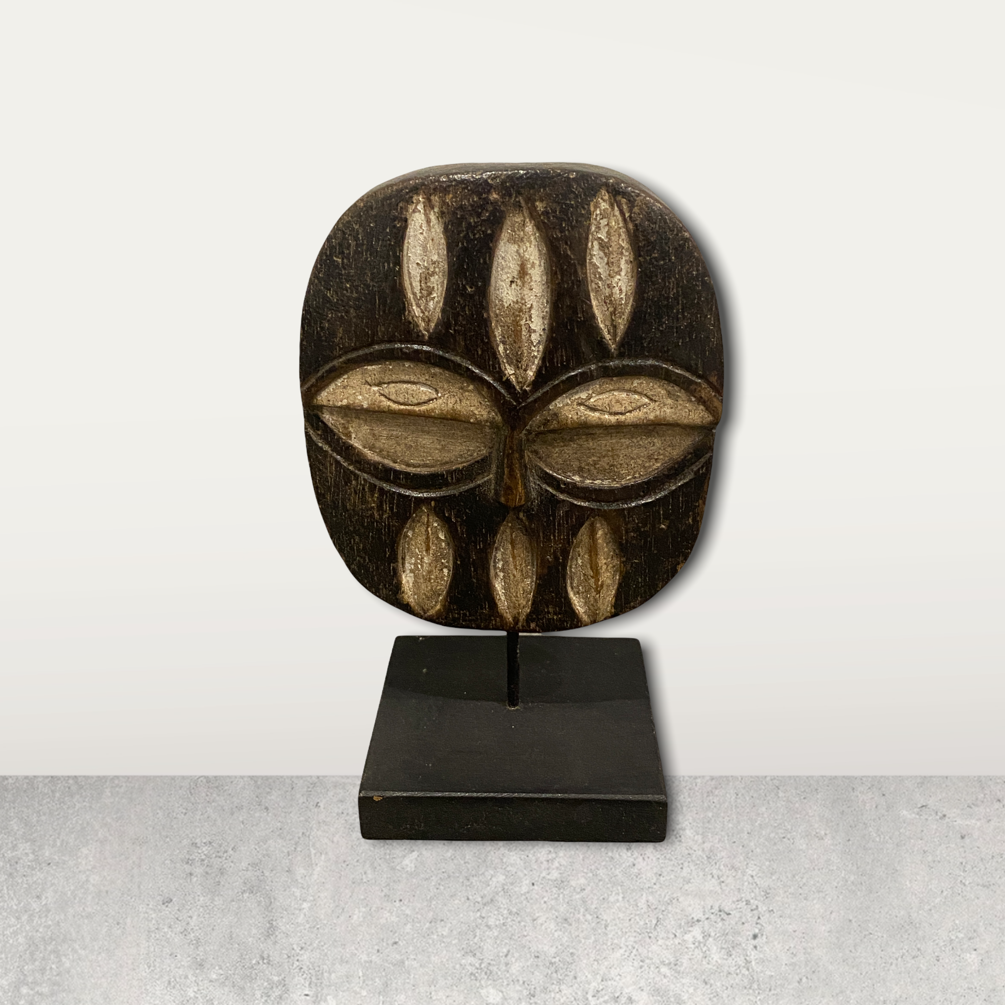 Small African mask on stand