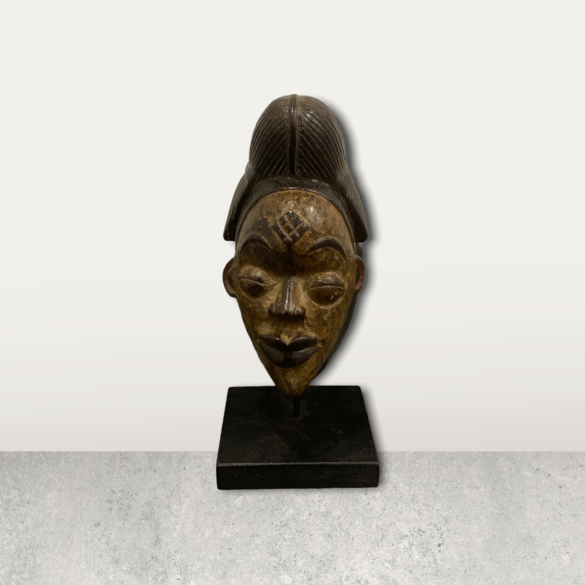 Small African mask on stands