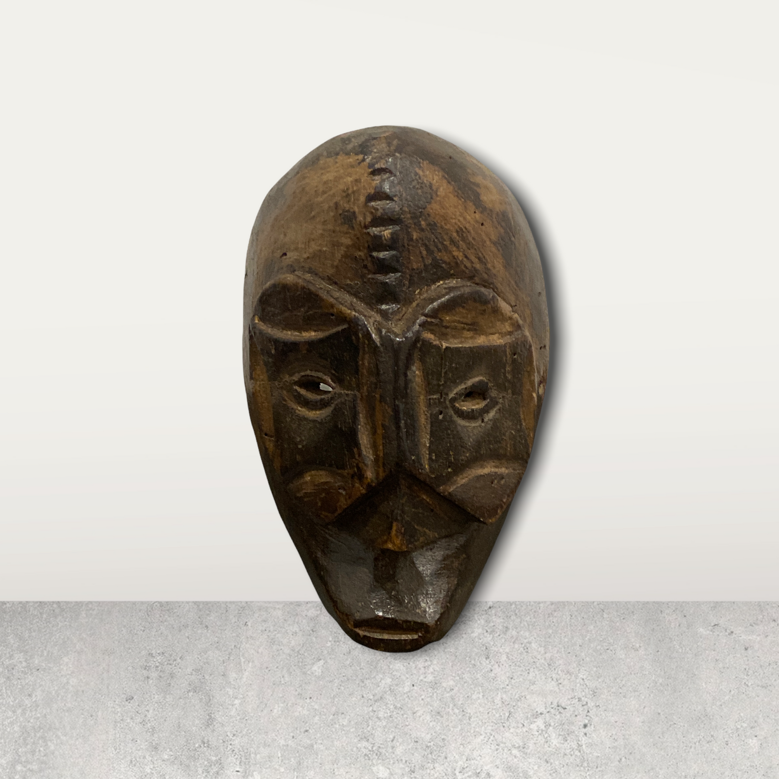 Small African mask on stand