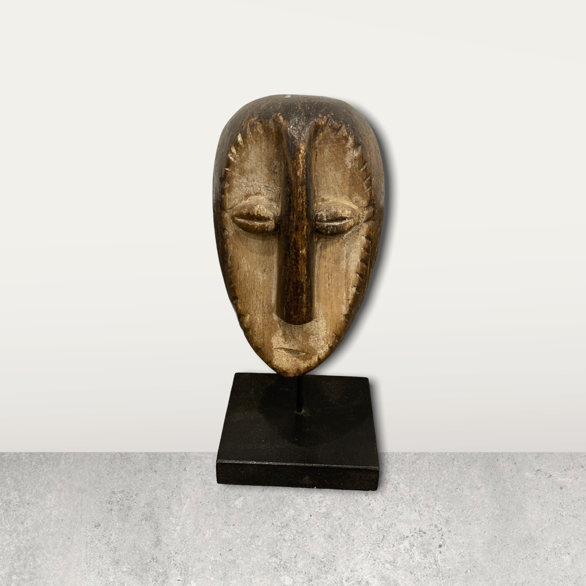 Small African mask on stand