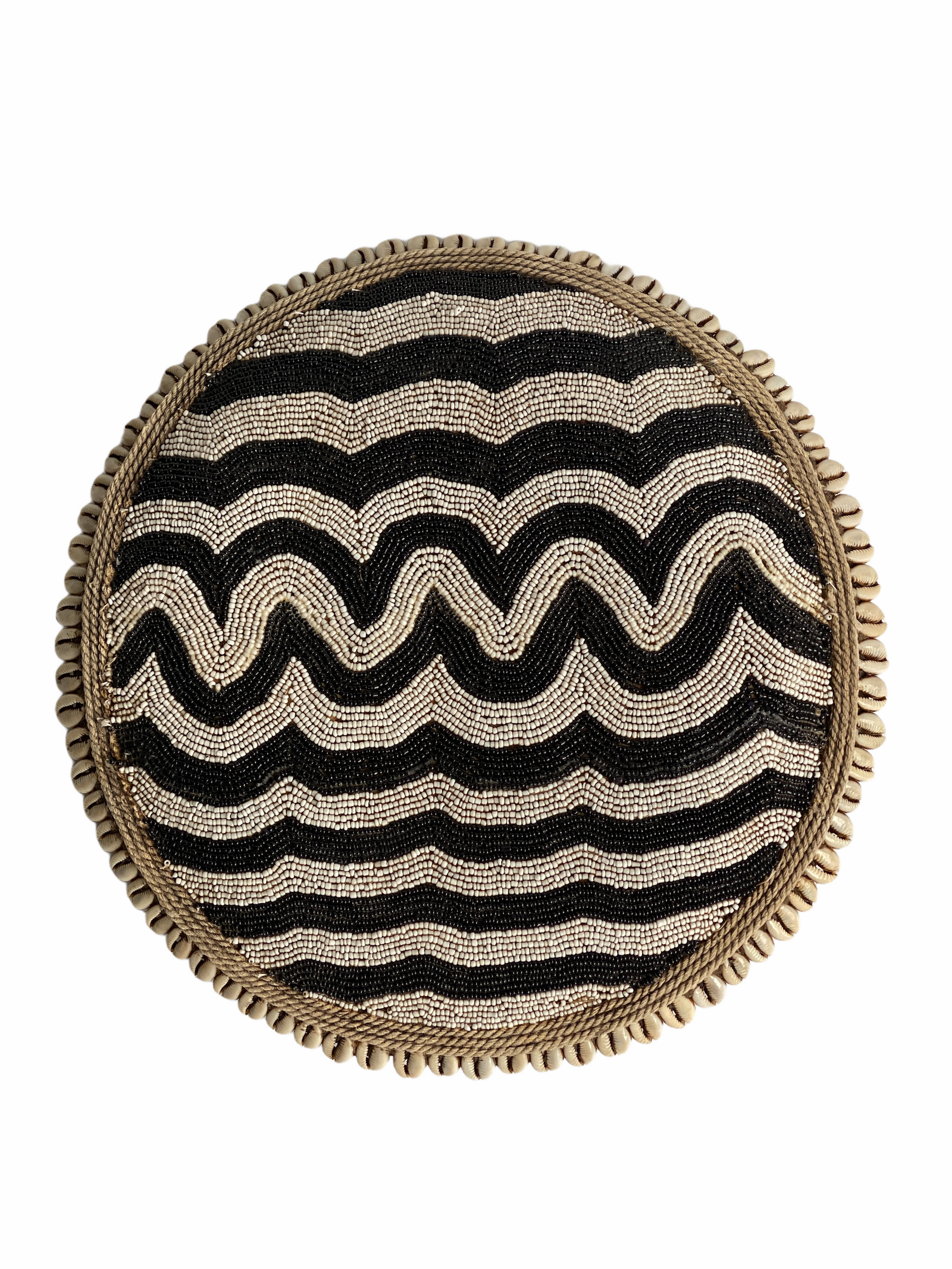 Cameroon beaded shield with black and white beads and cowrie shells