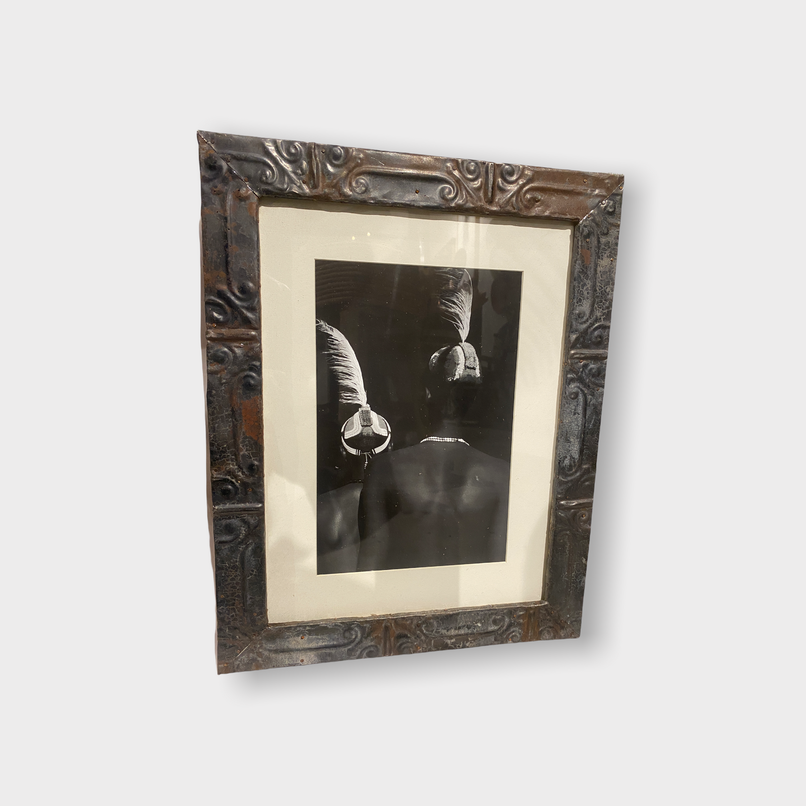 Photos of the vanishing tribes of the Omo Valley in Ethiopia, framed in a recycled tin ceiling press