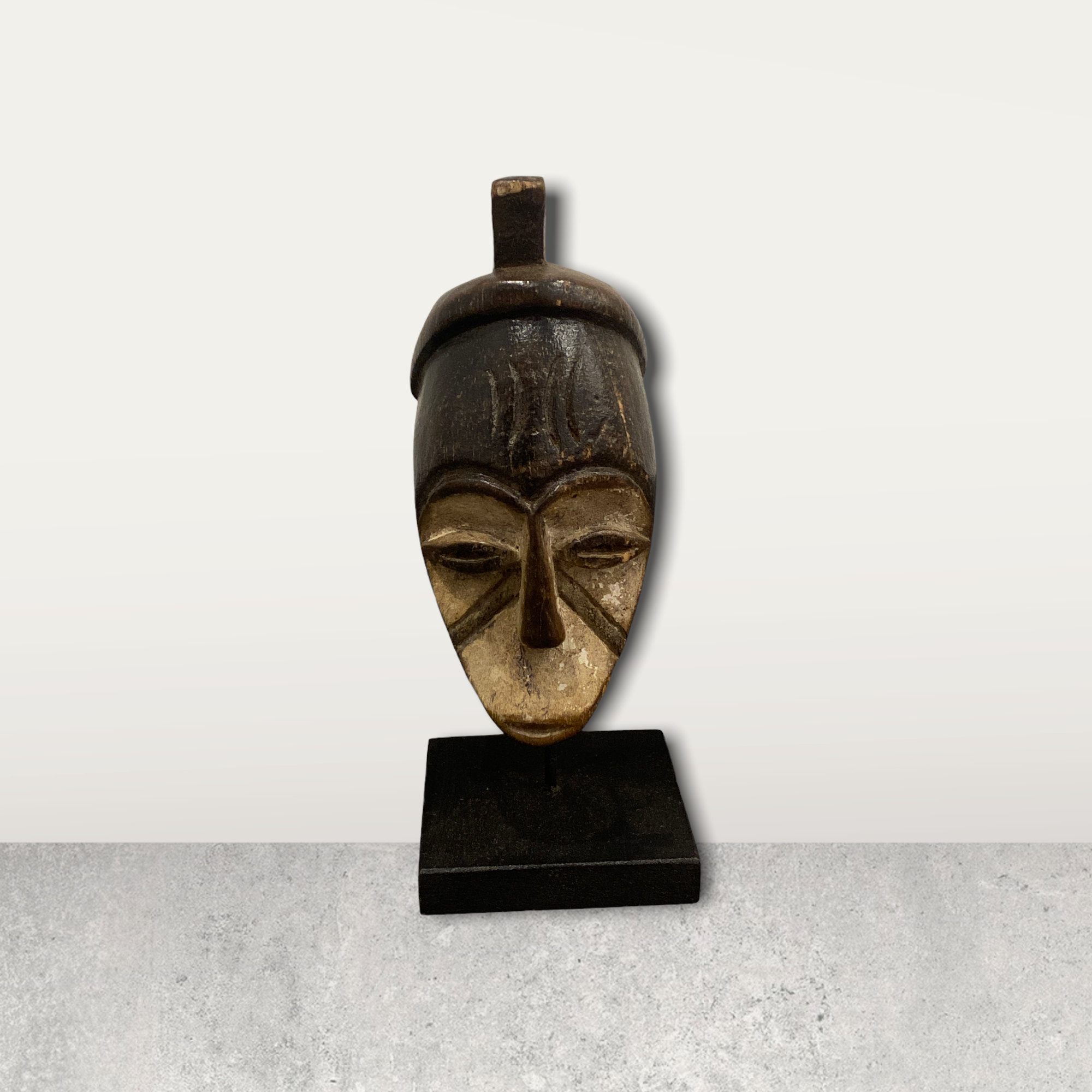 Small African mask on stands